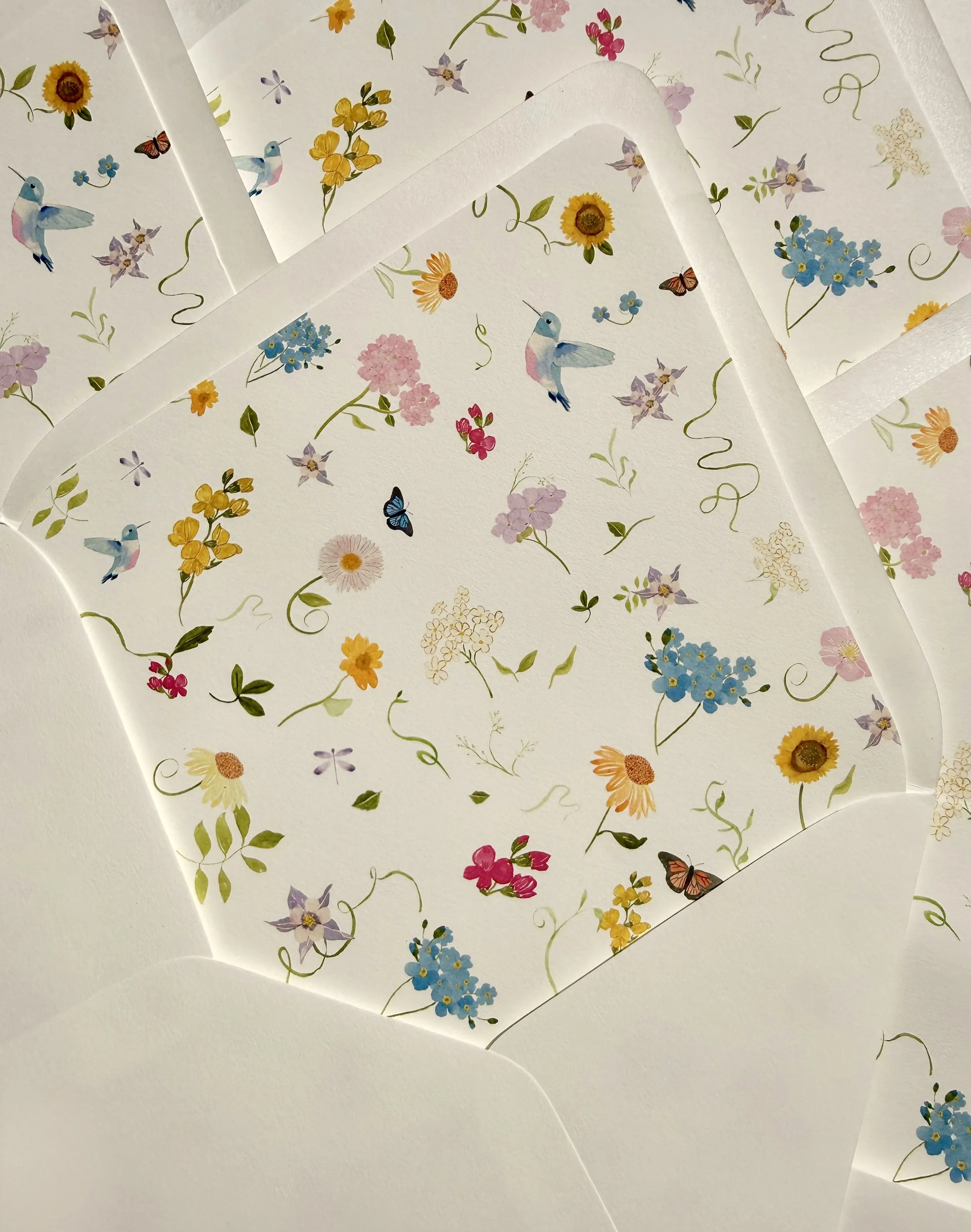 Hand painted watercolor illustrations of Colorado wildflowers, hummingbirds, and butterflies