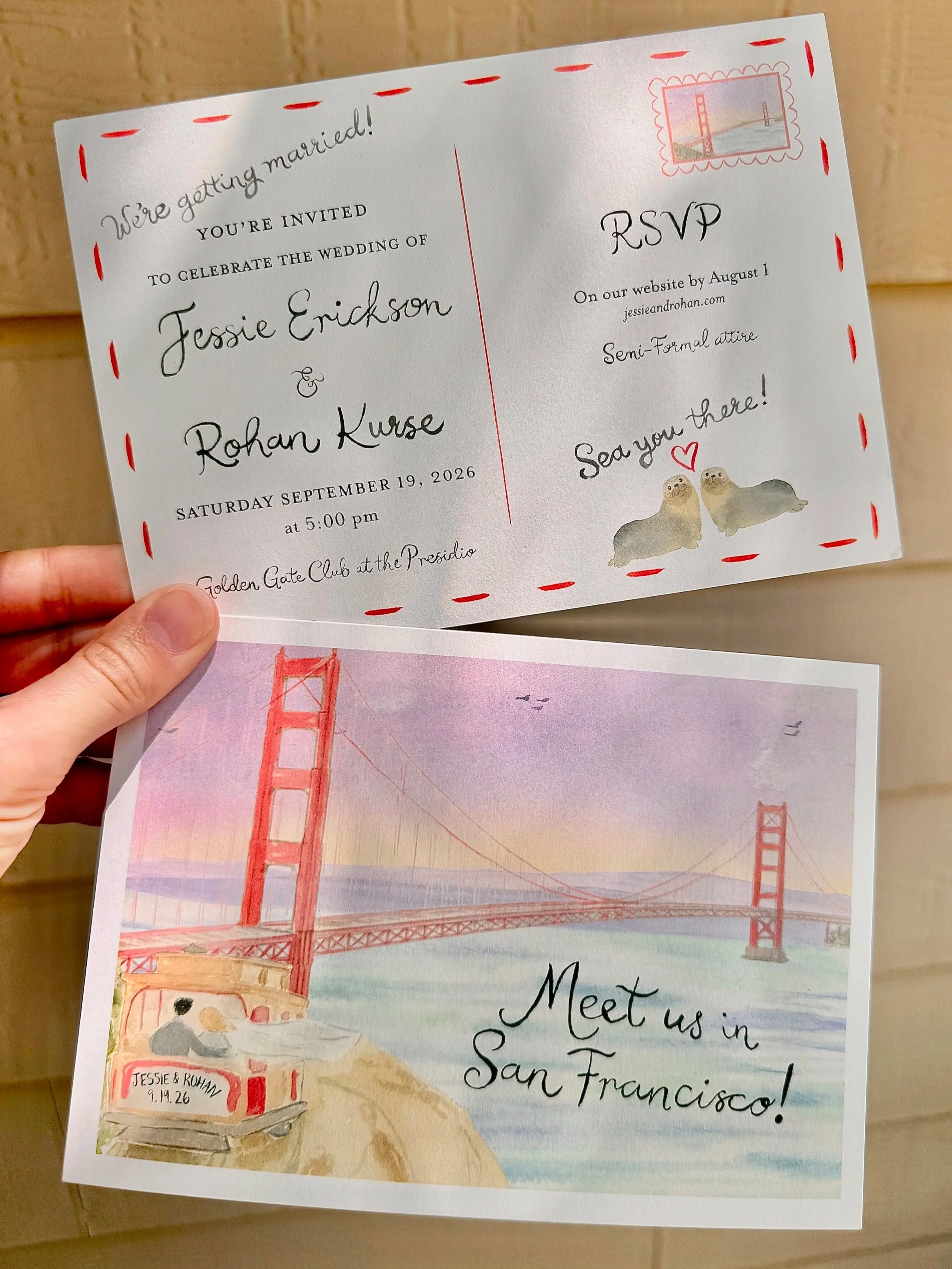 Illustrated San Francisco save-the-date with the Golden Gate Bridge, cable car, sea lions, and blue coastal details.