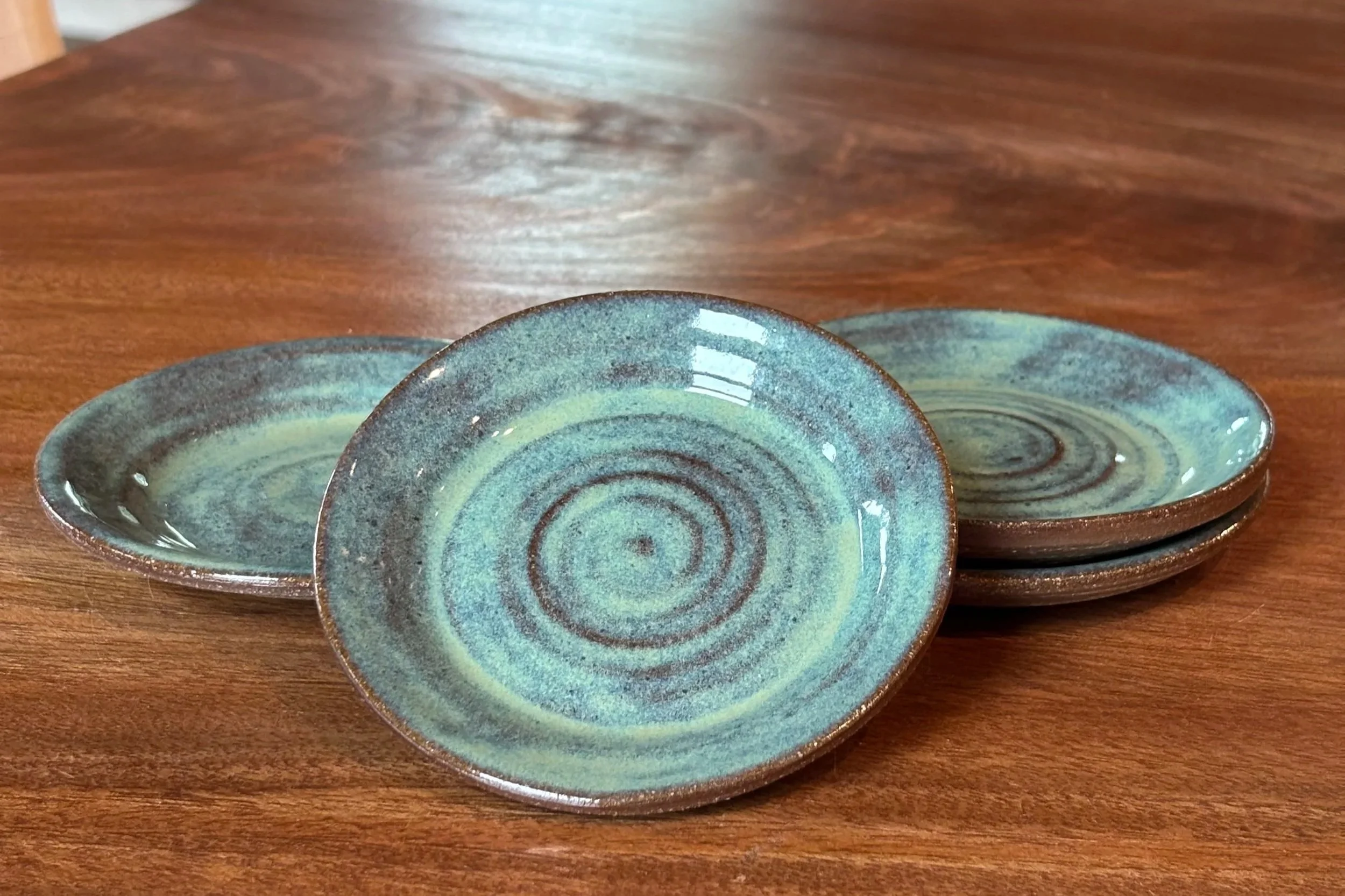 Turquoise Apps Plates on Brown Clay