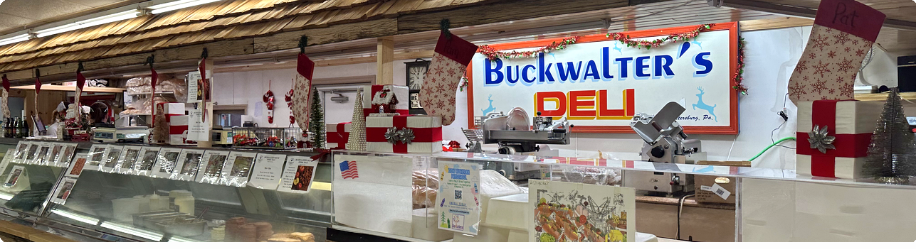 Counter at Buckwalter's Deli decorated with Christmas stockings and holiday-themed ornaments.