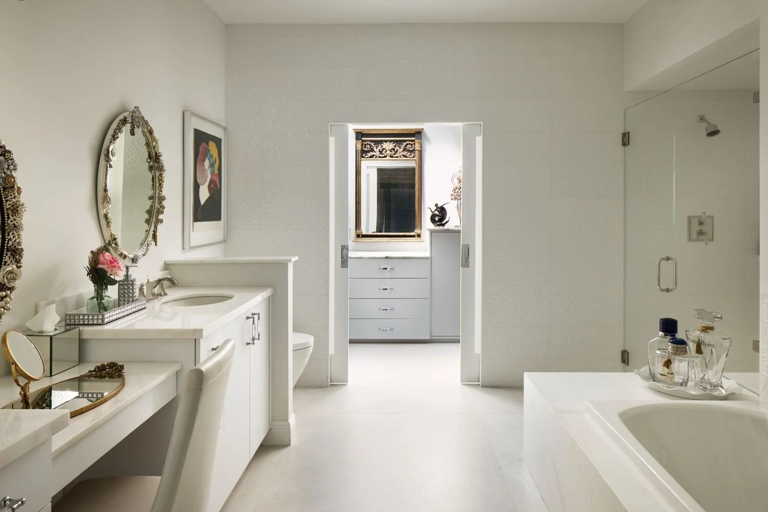 Luxury vanity area with clean-lined millwork, polished finishes, and a calm light-filled layout