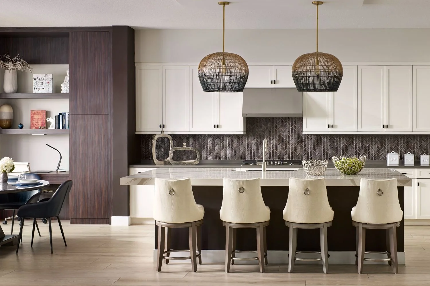 Contemporary kitchen with statement marble island, warm modern cabinetry, and sleek built-in appliances
