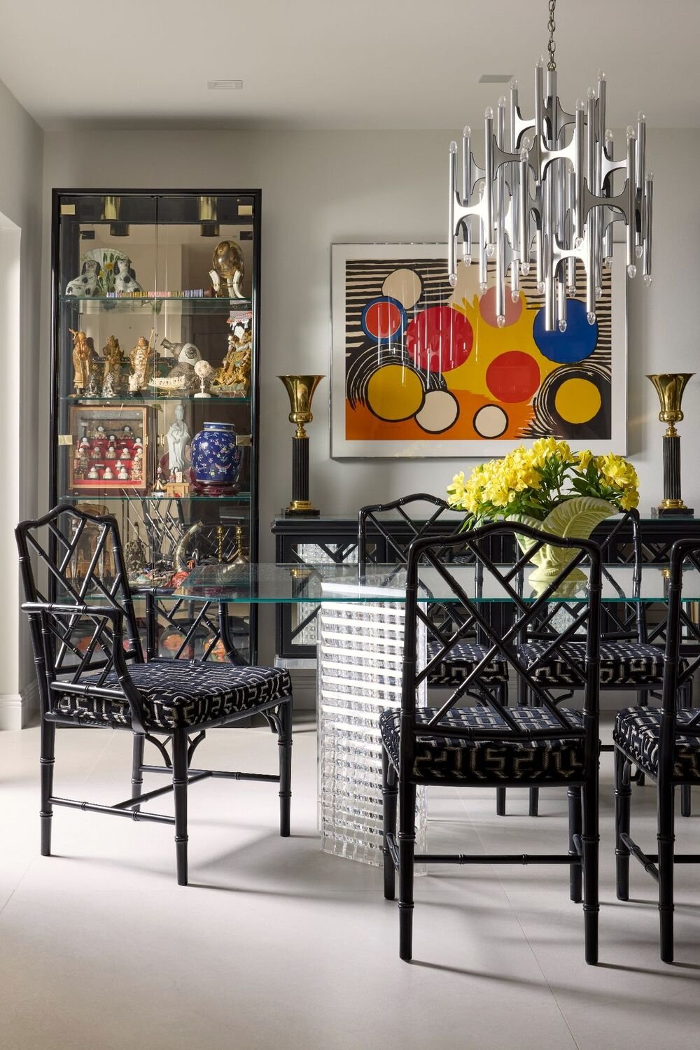 Boca Raton dining room with statement chandelier lighting, layered décor, and curated modern classic style