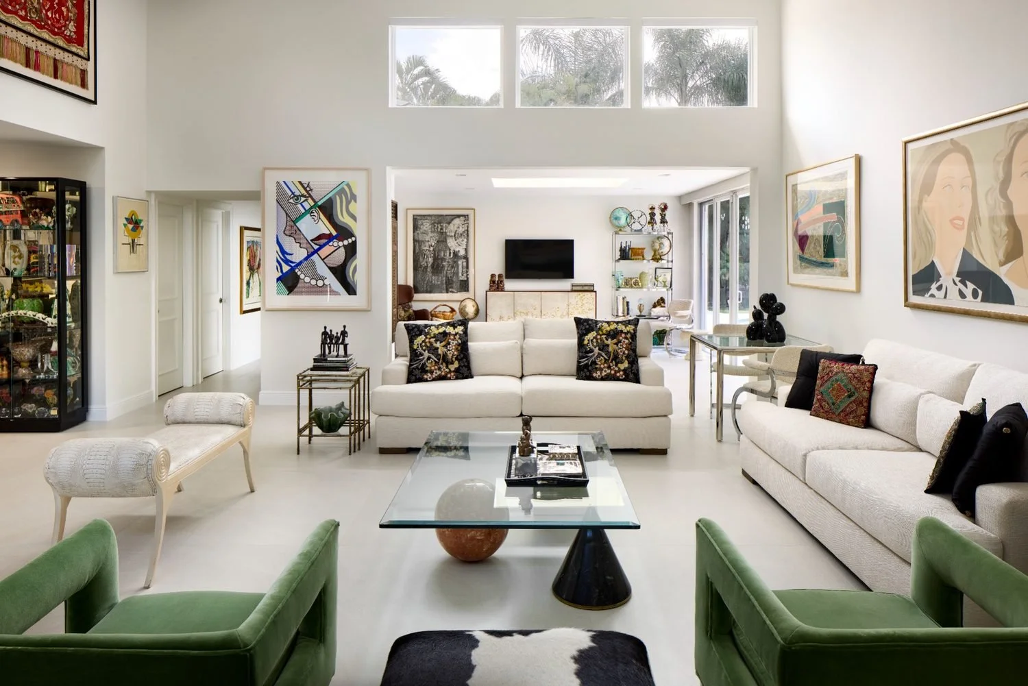 Boca Raton luxury living room with tailored sofas, layered artwork, and polished modern classic styling