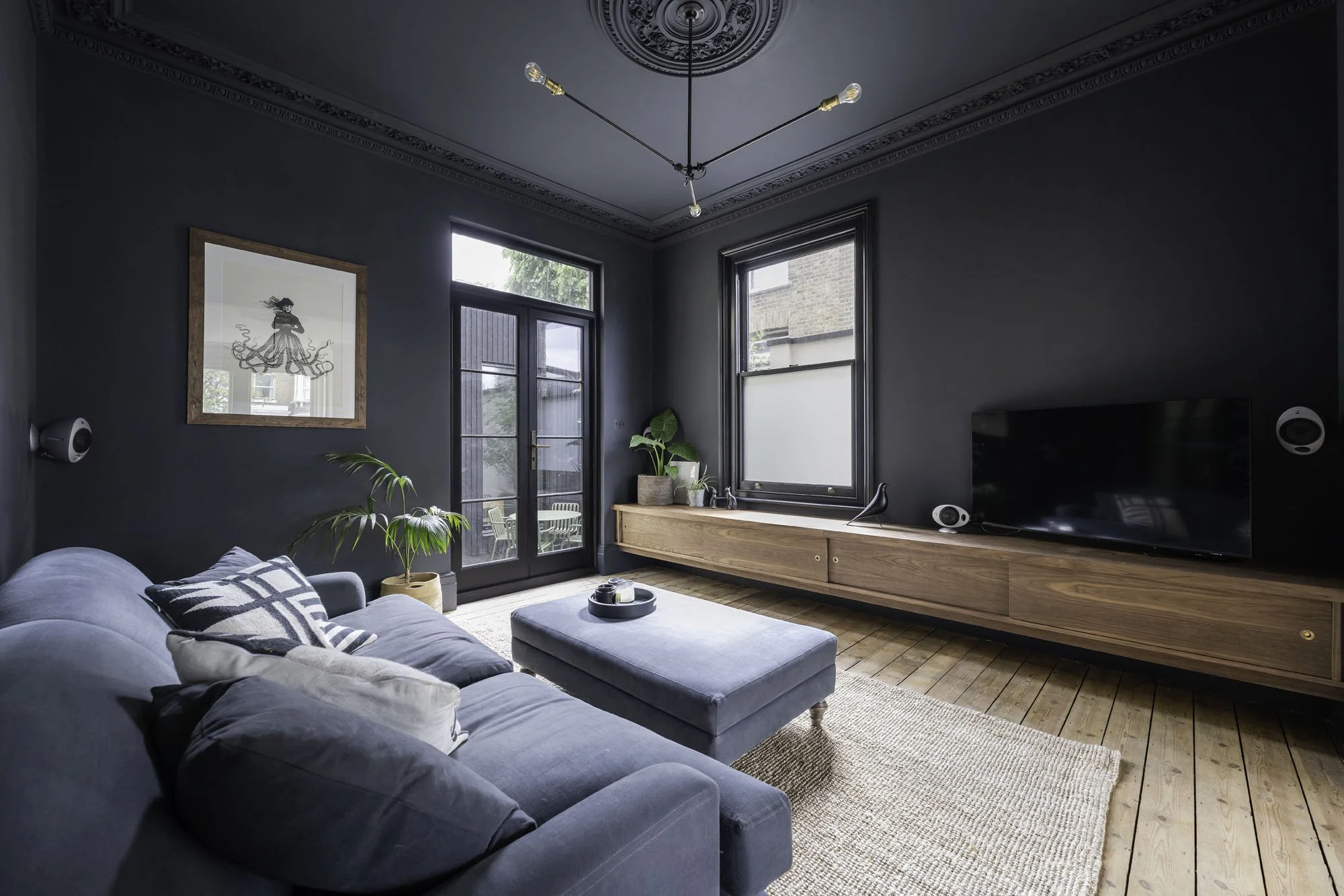 Bespoke minimal contemporary media unit made in solid and veneered walnut with brass pull handles, sliding doors and hidden LED lighting
