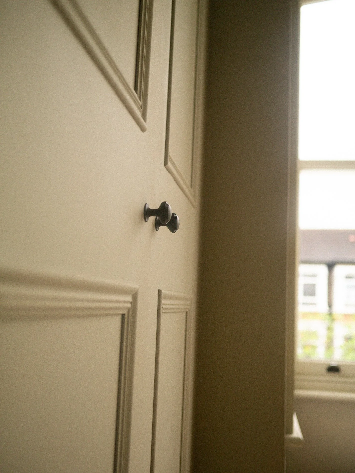 A pair Victorian Georgian bespoke fitted wardrobes with curved corner detail. Corston hardware and Farrow & Ball dead flat paint finish