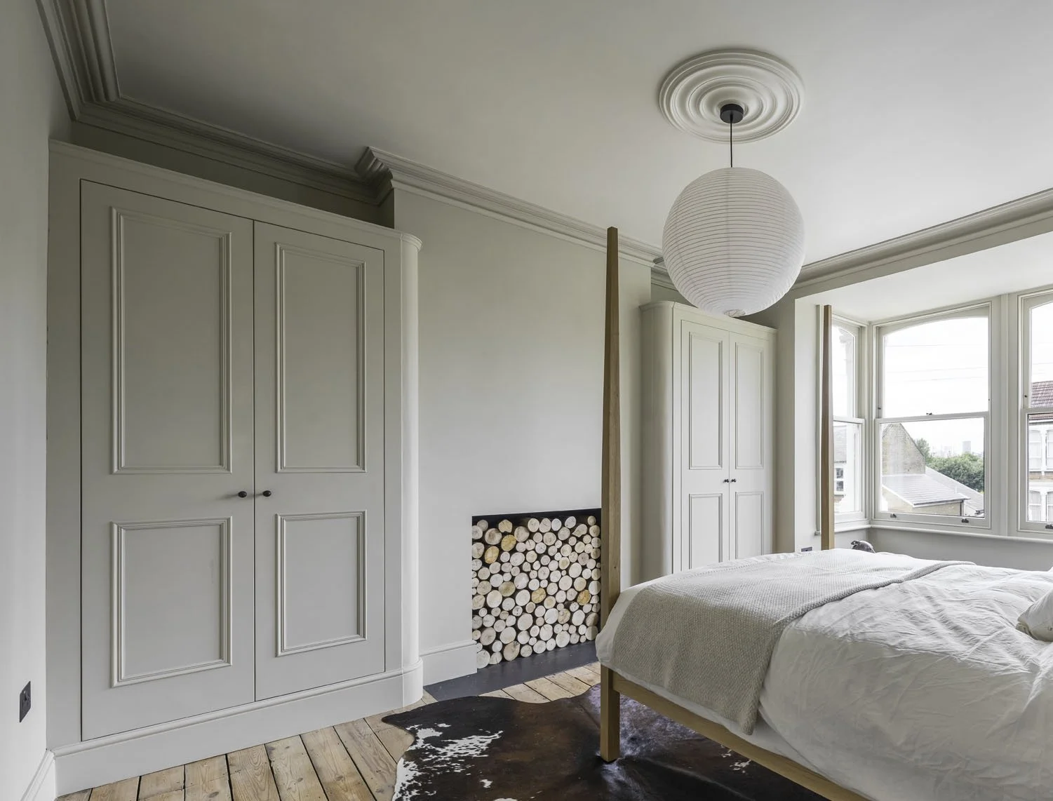 A pair Victorian Georgian bespoke fitted wardrobes with curved corner detail. Corston hardware and Farrow & Ball dead flat paint finish
