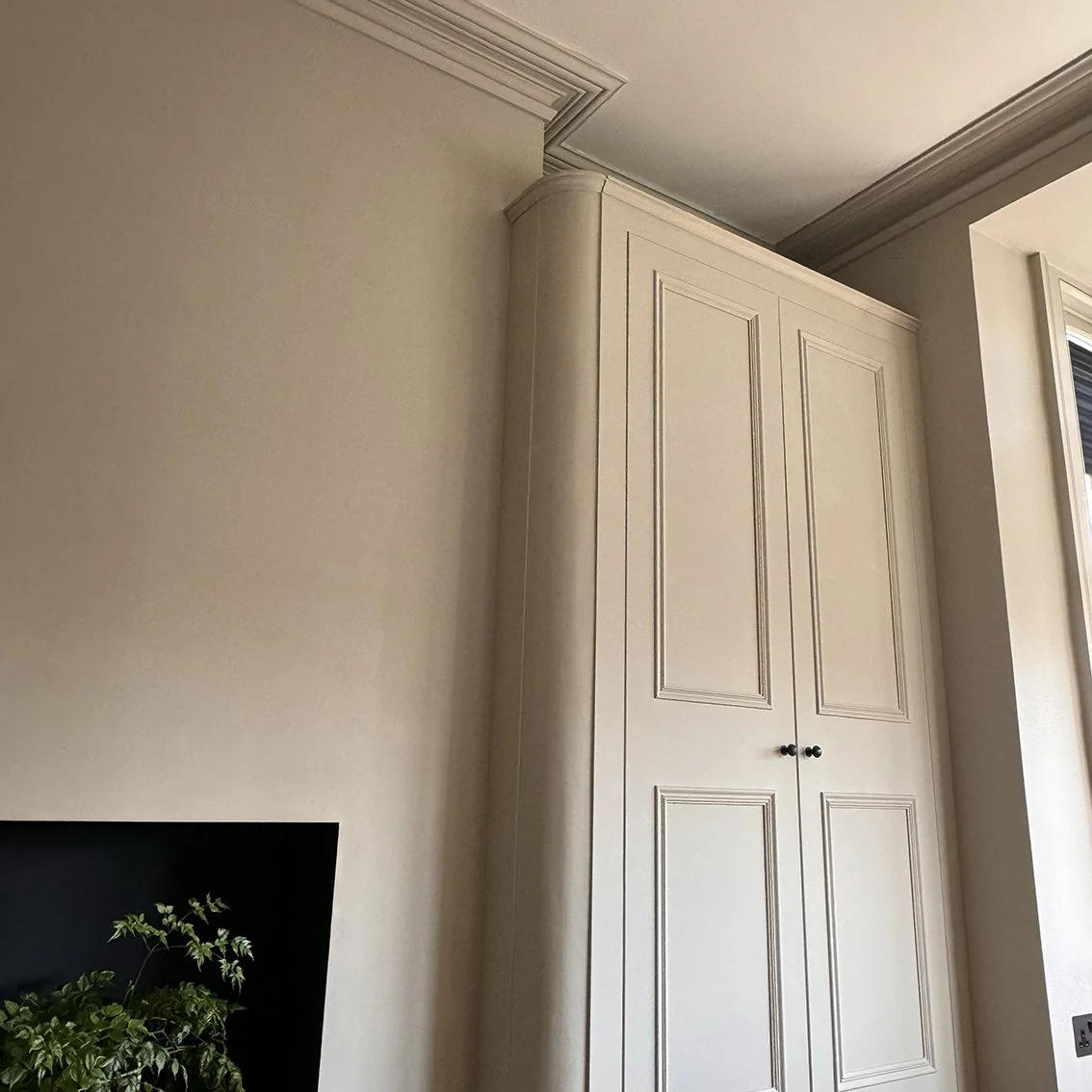 A pair Victorian Georgian bespoke fitted wardrobes with curved corner detail. Corston hardware and Farrow & Ball dead flat paint finish