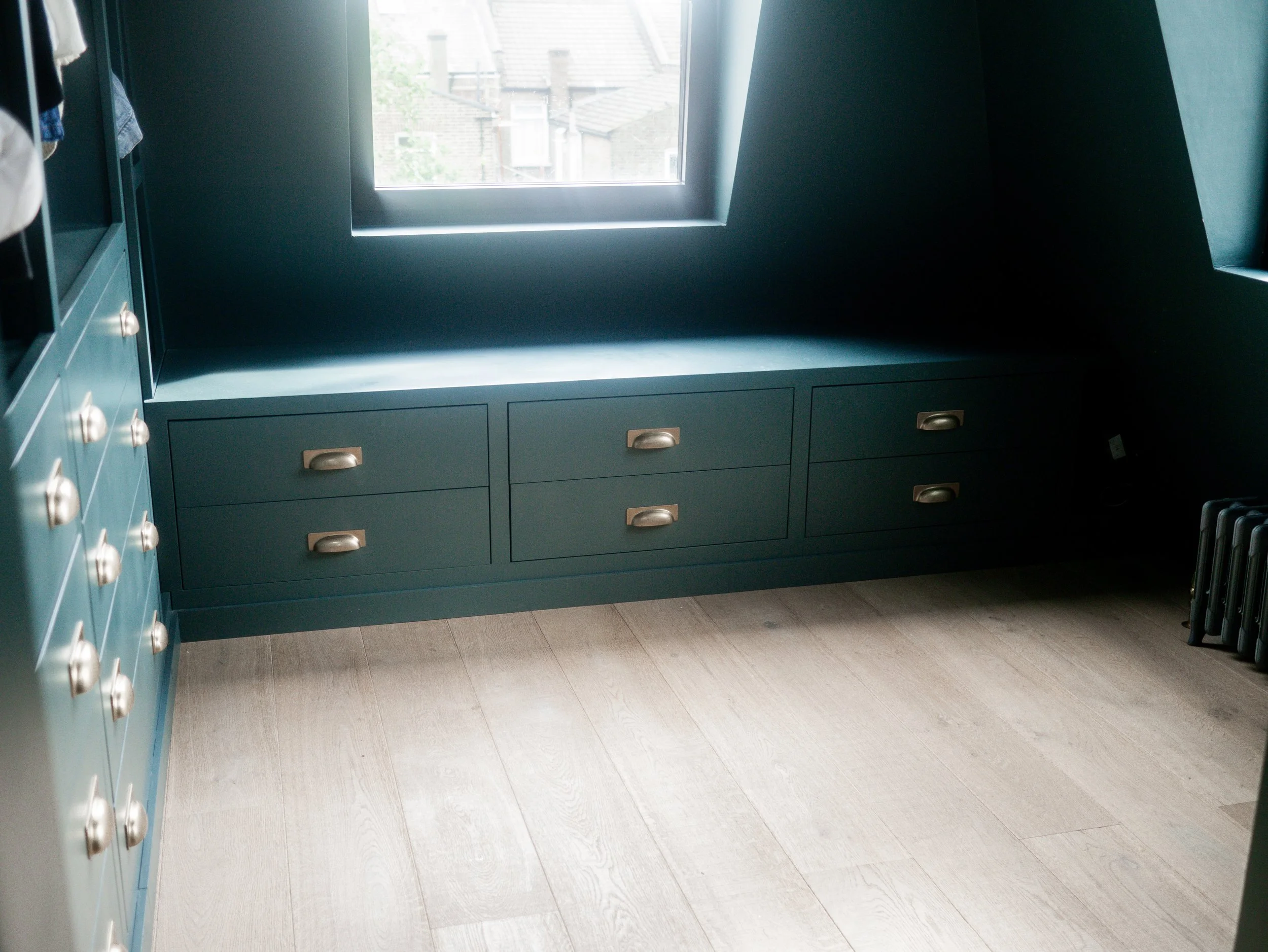 Bespoke dressing room wardrobe room with hidden storage and hidden LED lighting 