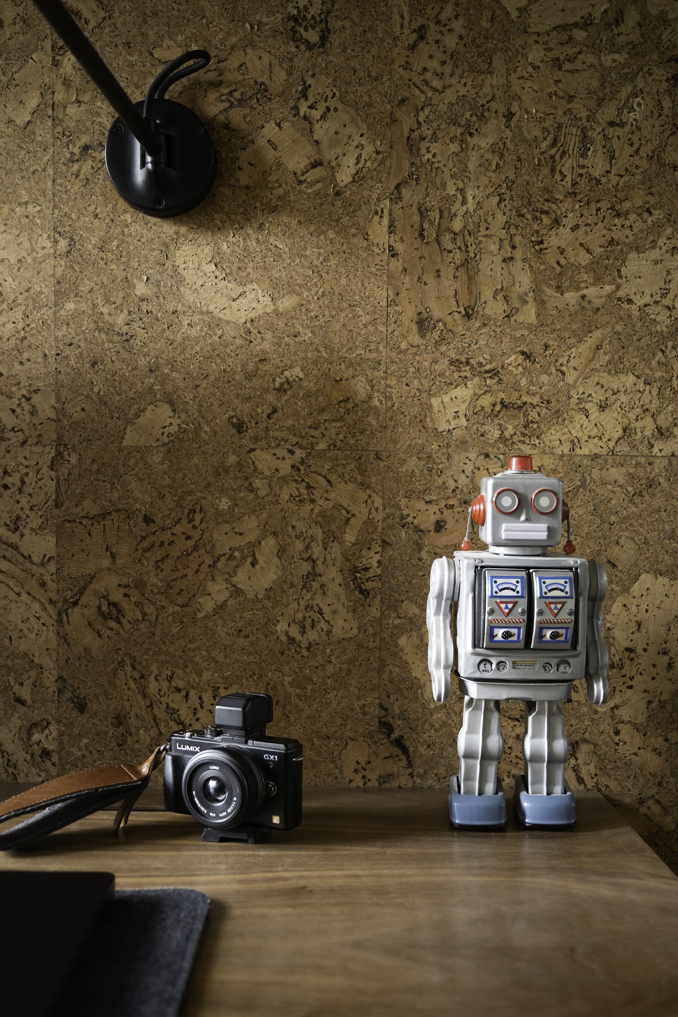 Bespoke study desk in veneered and solid walnut, cantilevered from cork accent wall