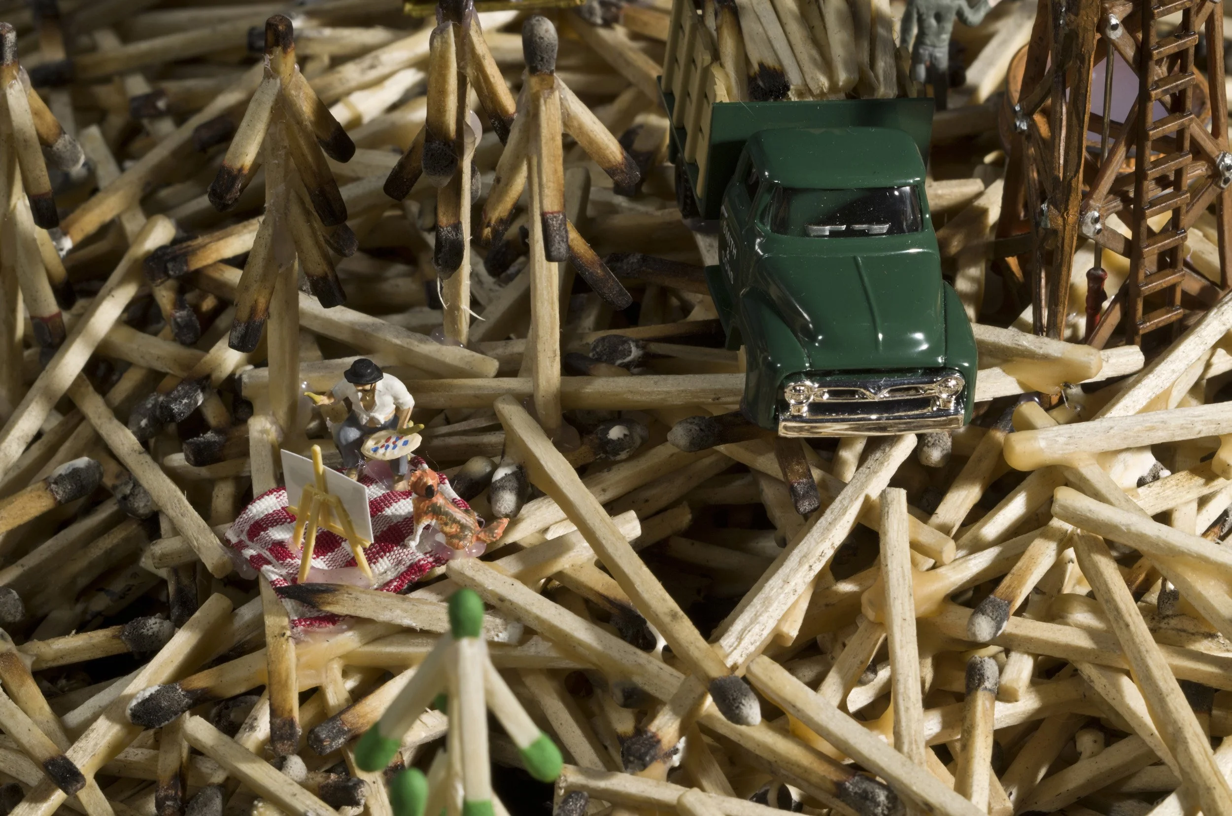 DEEP DISH ECOLOGY-detail 2, wooden matchsticks, miniature figures, aluminum pan, 6" h x 18" dia., 2013,  Flash Point Series  