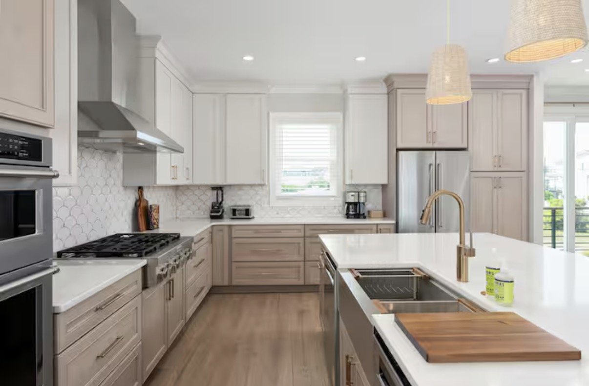 Custom kitchen finish selections for this luxury beach house in Kure Beach, featuring carefully curated cabinetry, backsplash tile, countertops, and hardware designed to create a timeless coastal feel with warmth, texture, and functionality.