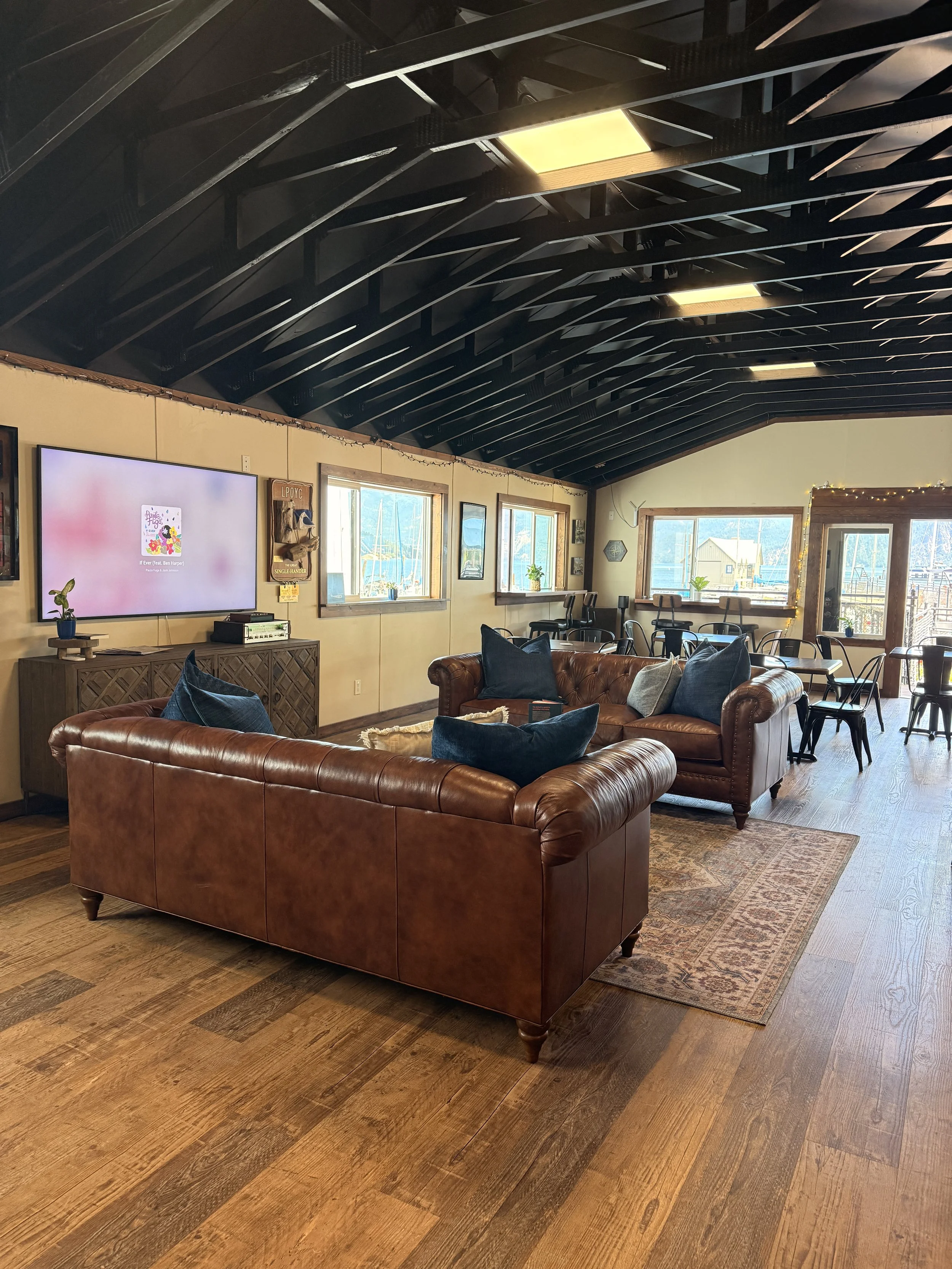 Designed for both beauty and function, this café bar space balances efficiency with rustic charm through custom millwork, layered wood tones, and welcoming design details.