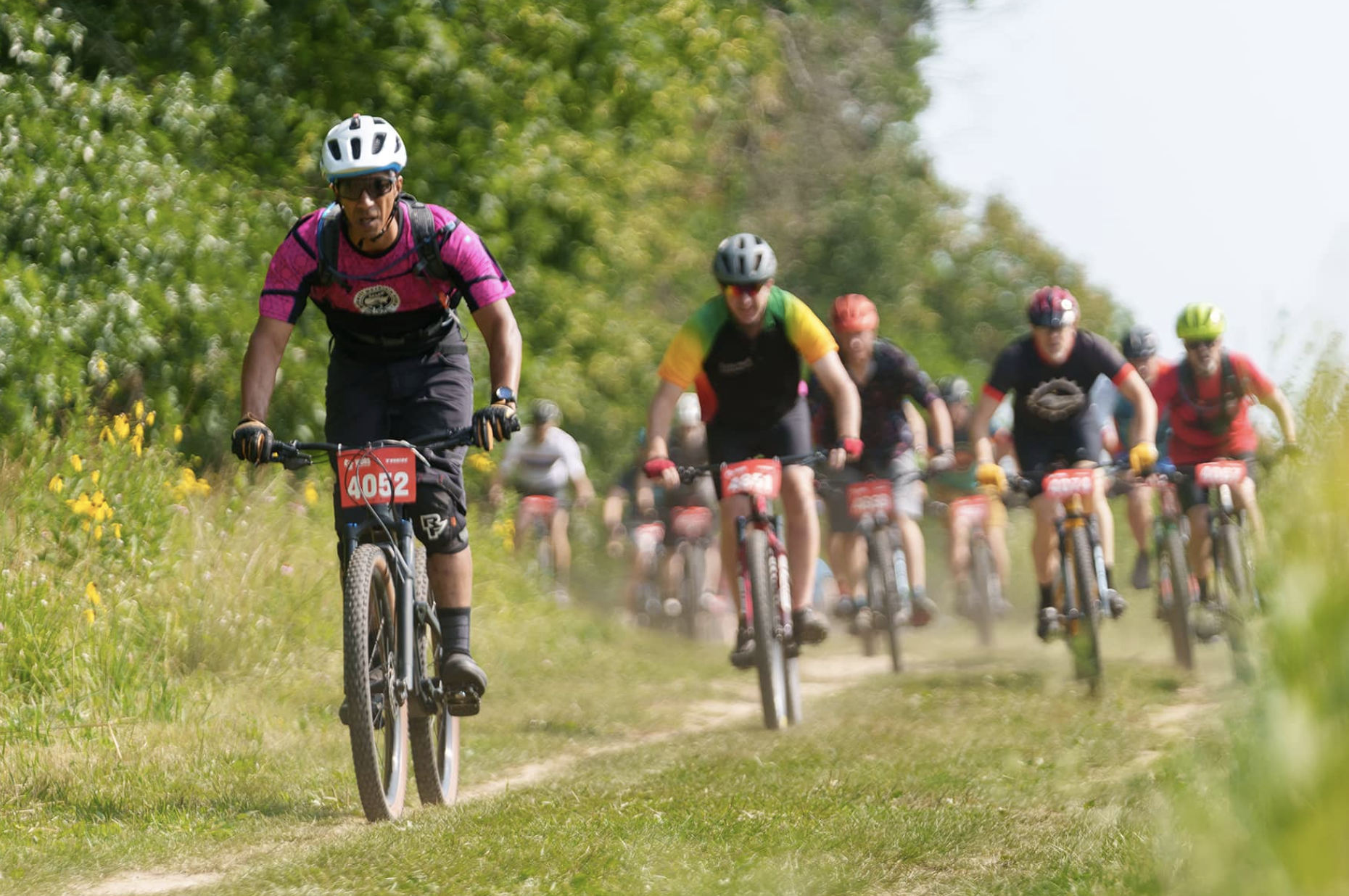 Dr. Kenneth Cole, riding a mountain bike at a race in Wisconsin.