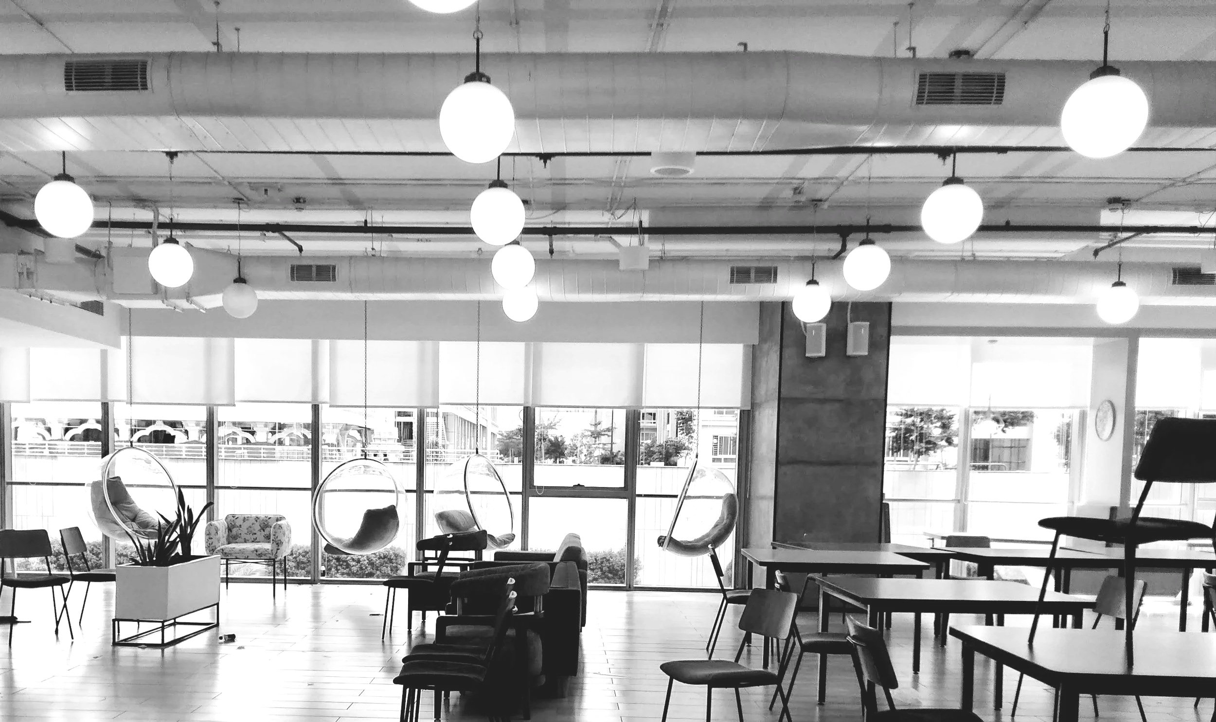 Black and white office environment representing sales systems, structure, and operational clarity