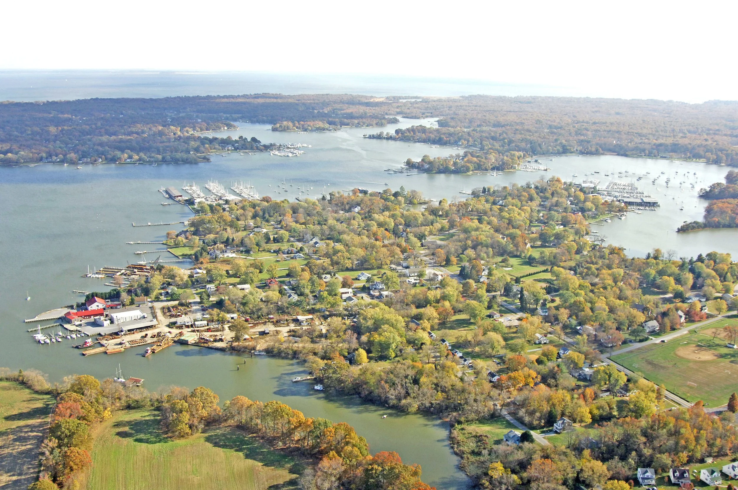 Aerial view of a Galesville with boats, a marina, and the West River