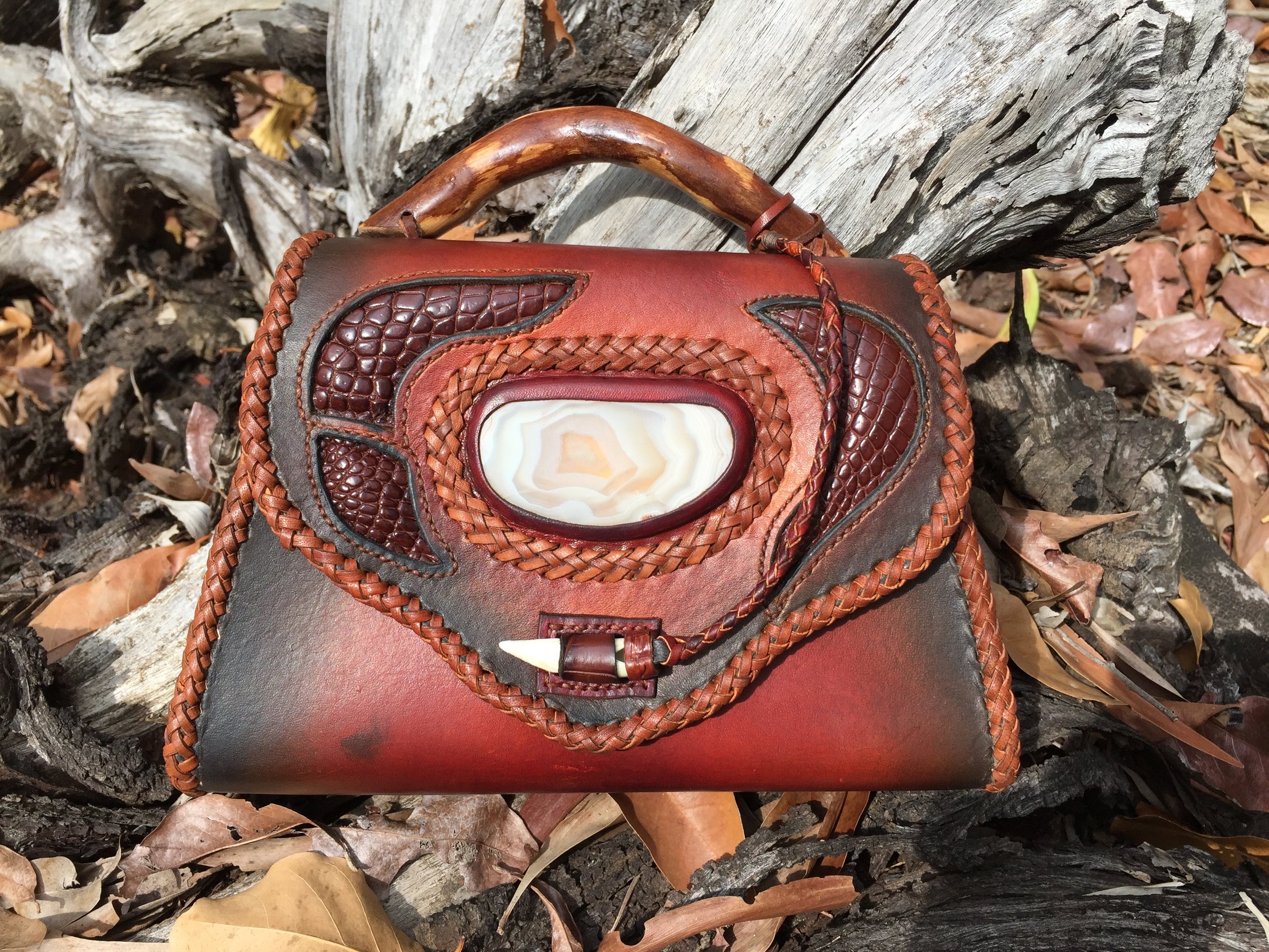 From my really early days.  I had fewer technical skills but was so enthralled by all the applications possible that I had to try them all!
The stone is Northern Territory agate given to me by some crafting friends and the handle is from our back pad