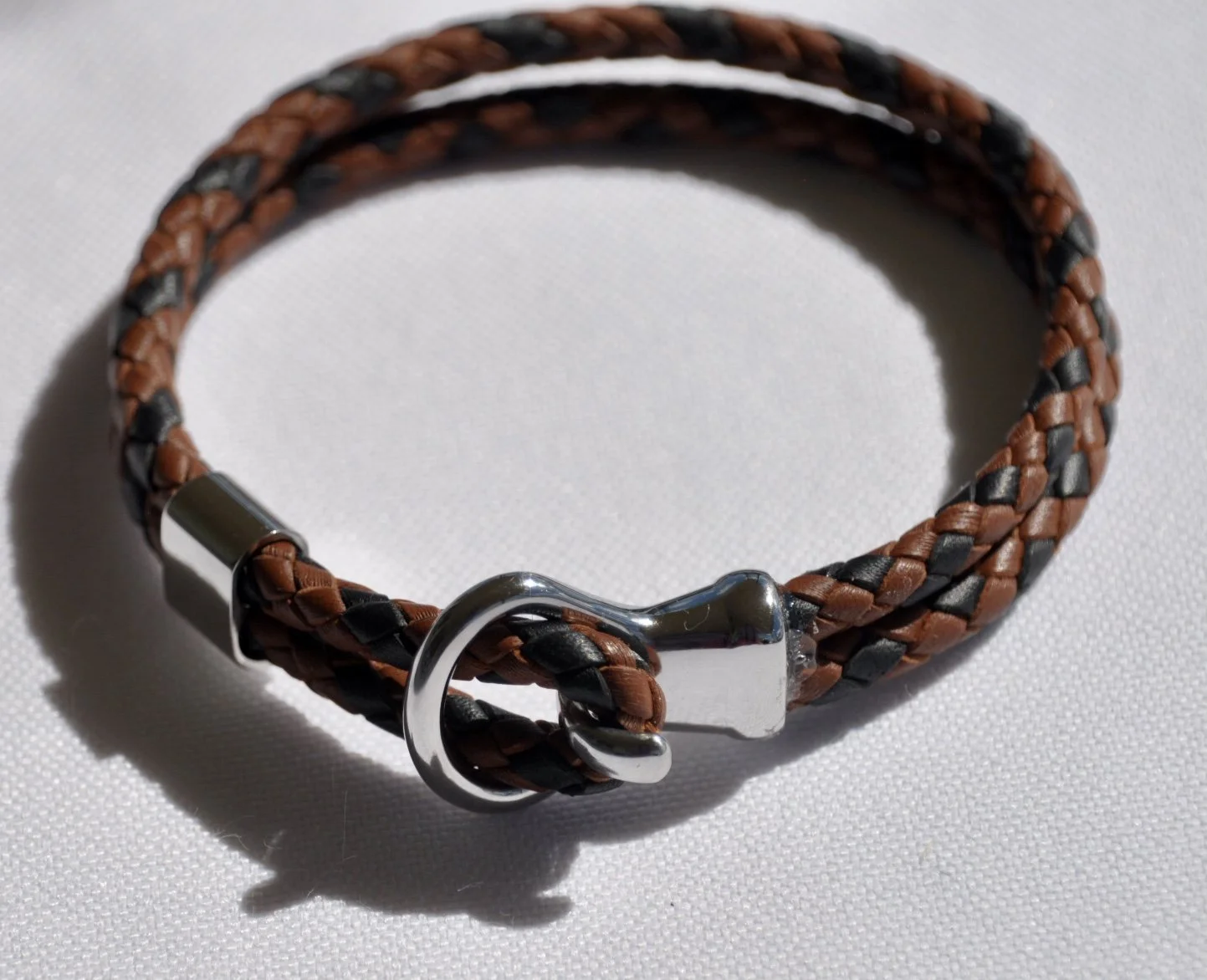 A bracelet popular with everyone.  Quality stainless steel hardware completes the finish of this 6 strand round braid in kangaroo lace.