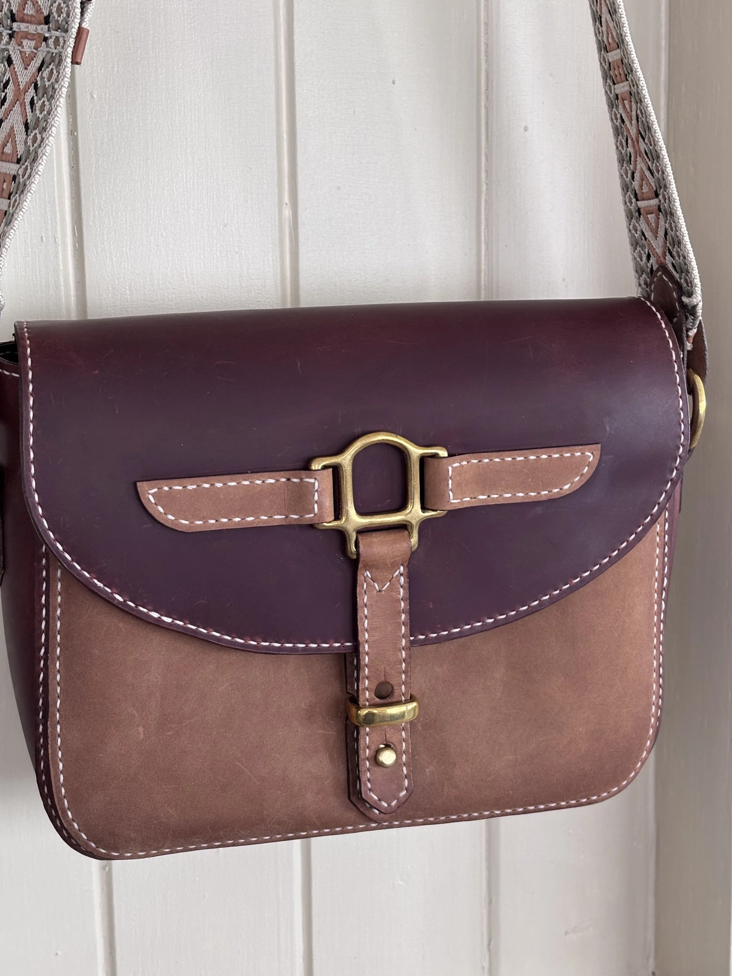 A leather shoulder bag with a two-tone design, made sturdy for everyday use.