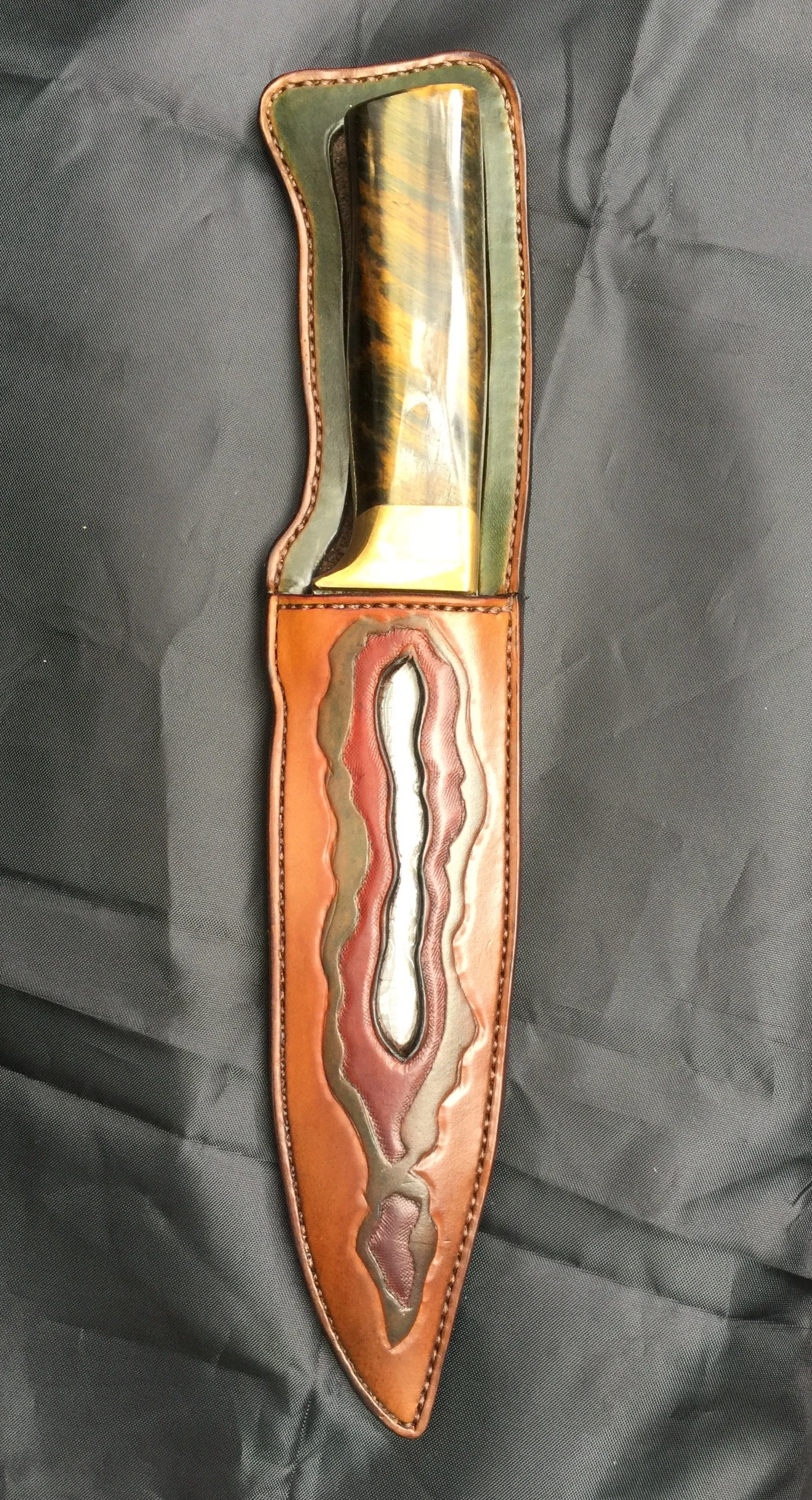 I custom made the sheath  to perfectly compliment this beautifully hand crafted knife 