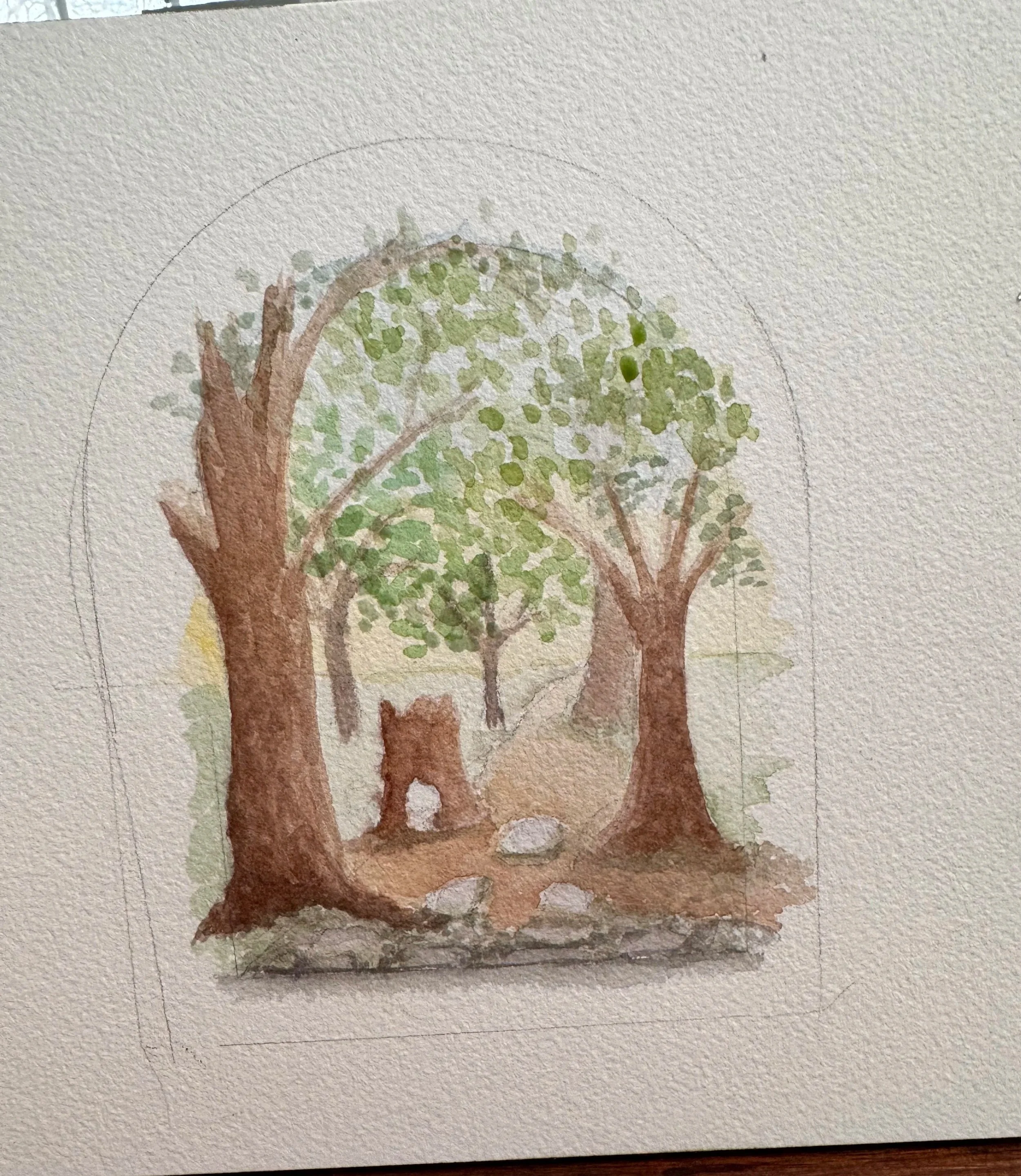 a partially complete watercolor painting of a forest path