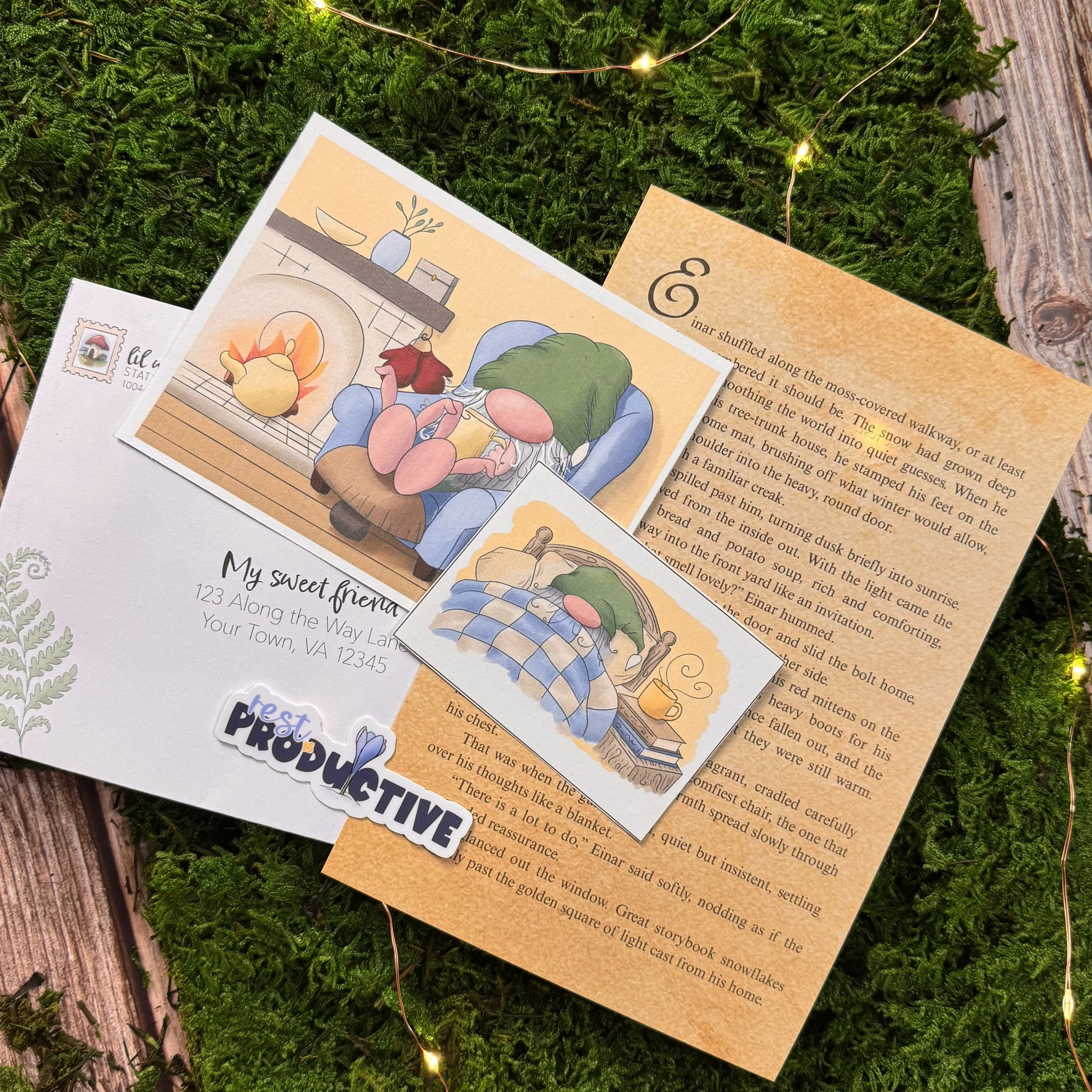 Greeting card, illustrated letters, and stickers with snow-themed drawings on green moss and wood background.