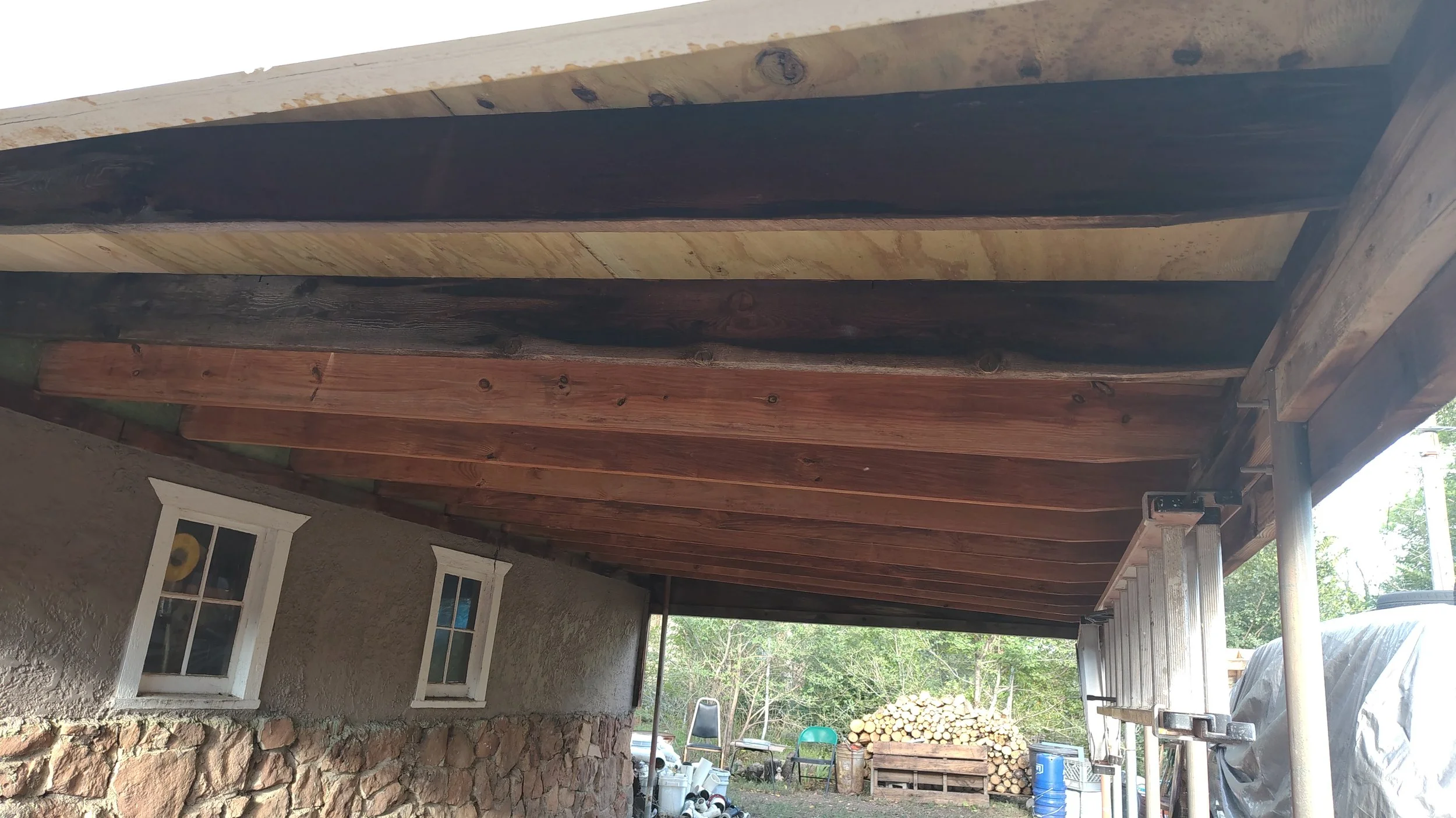 Carport roof rebuild after installing sheathing