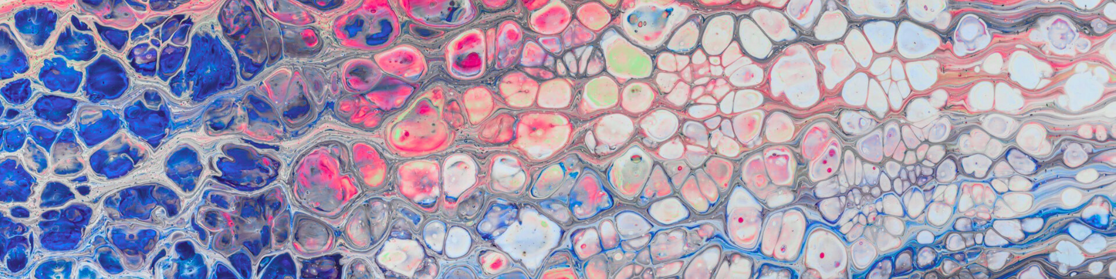 Abstract oil paint pattern with clusters of blue, pink, and white cells.