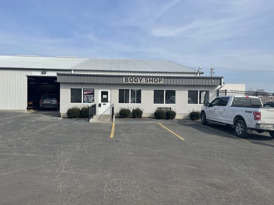 Automotive repair facility with overhead doors and workspace