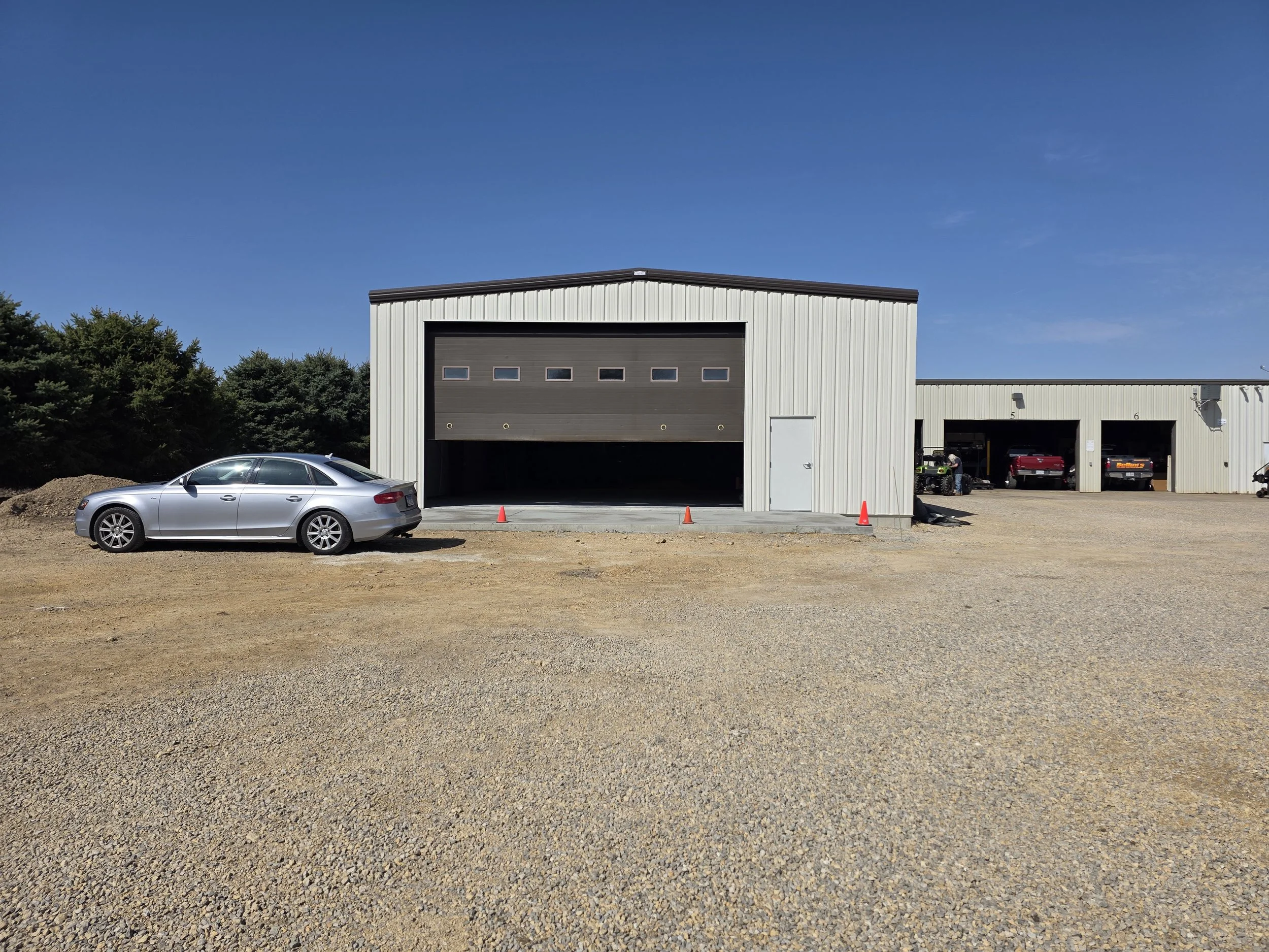 Engineered steel building constructed by American Eagle Buildings with large overhead door
