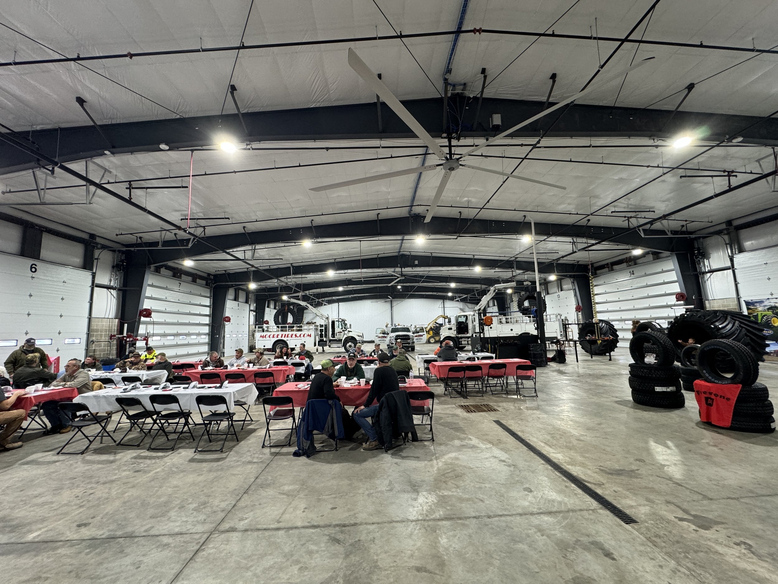 Steel Building Interior with Large overhead doors and industrial fans
