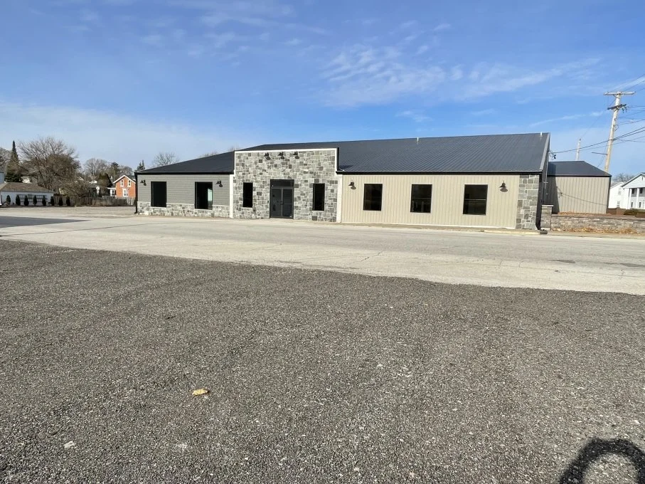 Completed post-frame building with metal siding and roof
