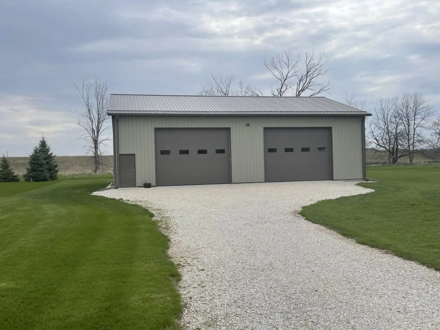 Pole barn with wide entry for agricultural equipment