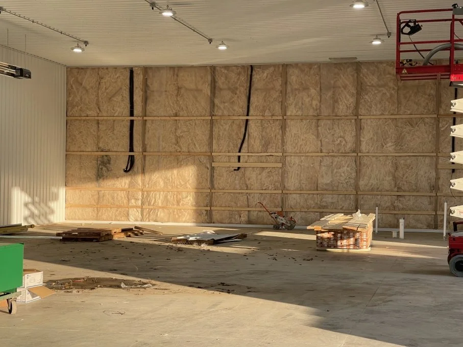 Fiberglass insulation installed in building wall system