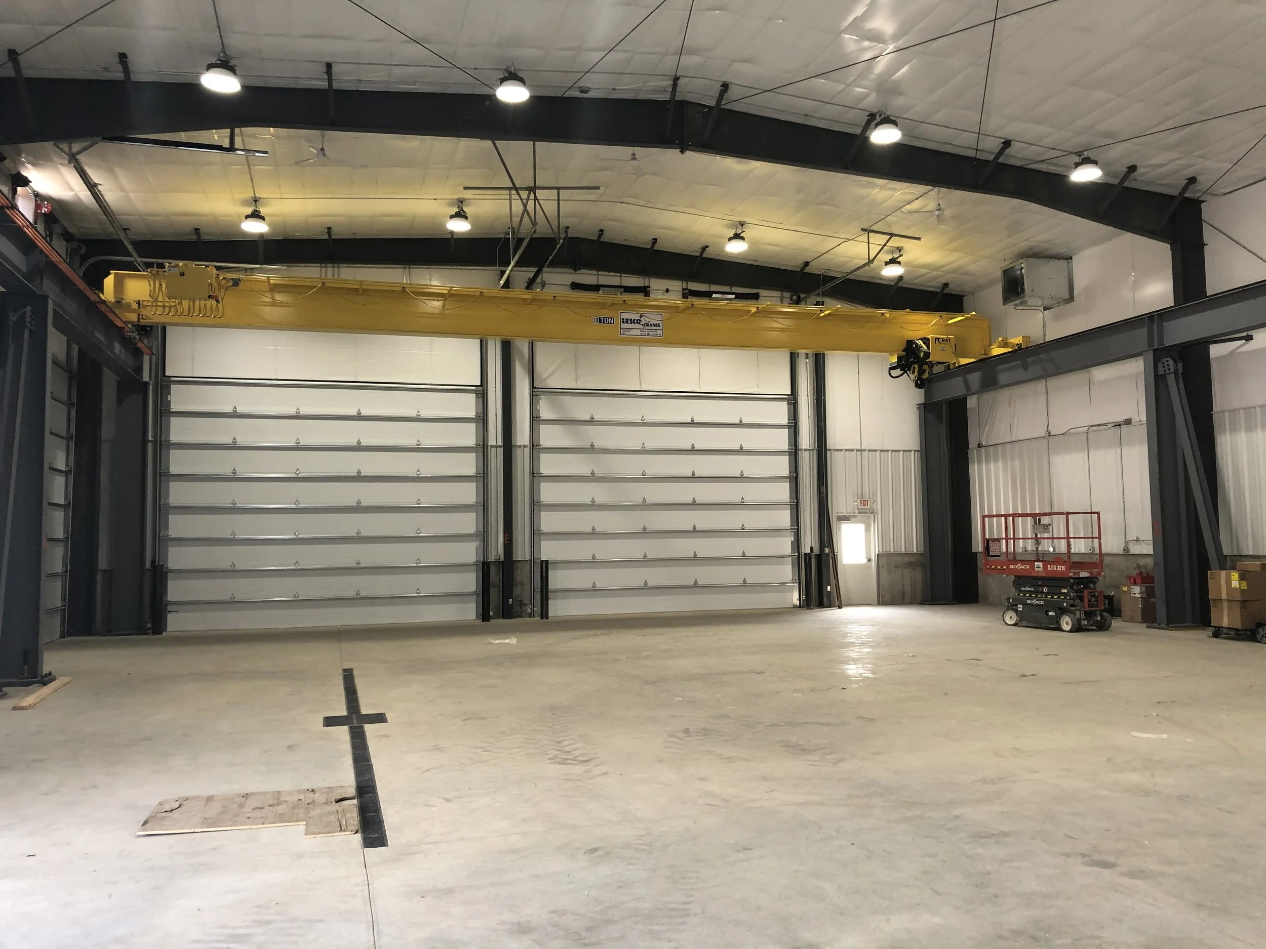 Steel building with large overhead doors and overhead crane system