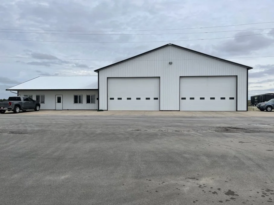 Pole building with insulated walls and steel liner