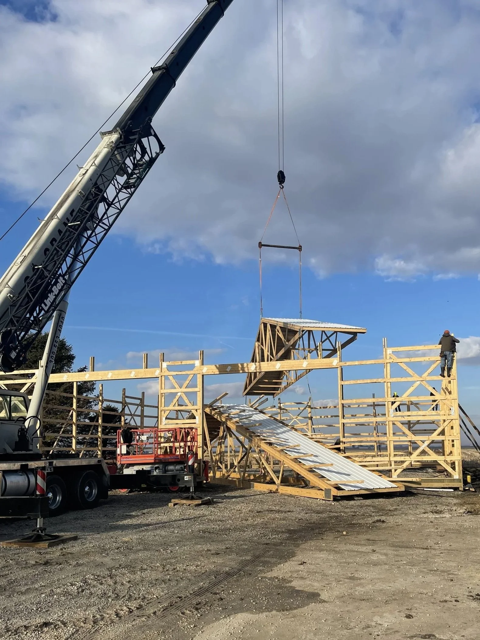 Wood post-frame wall structure during building process