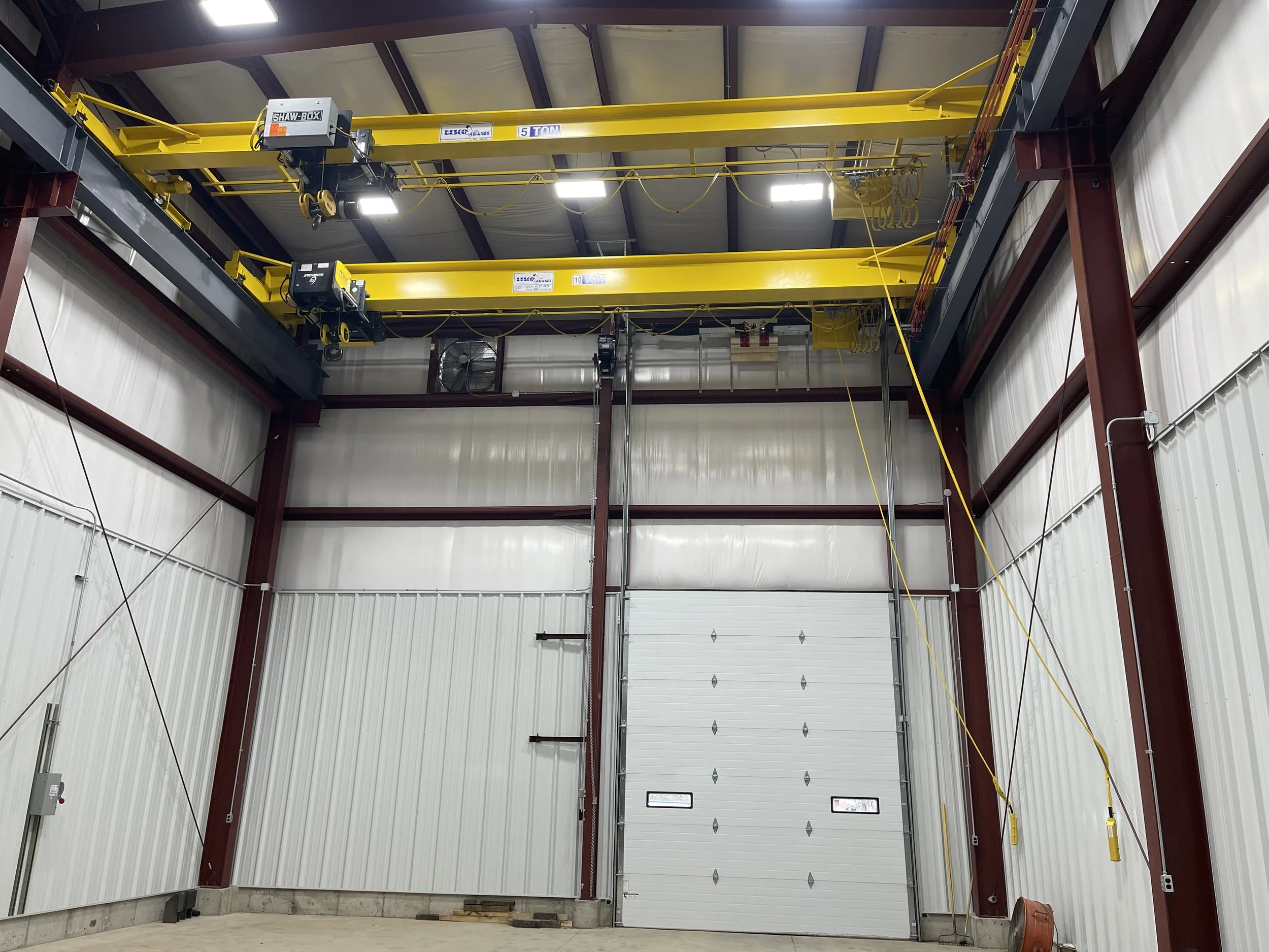 Commercial metal building with crane system and large bay door