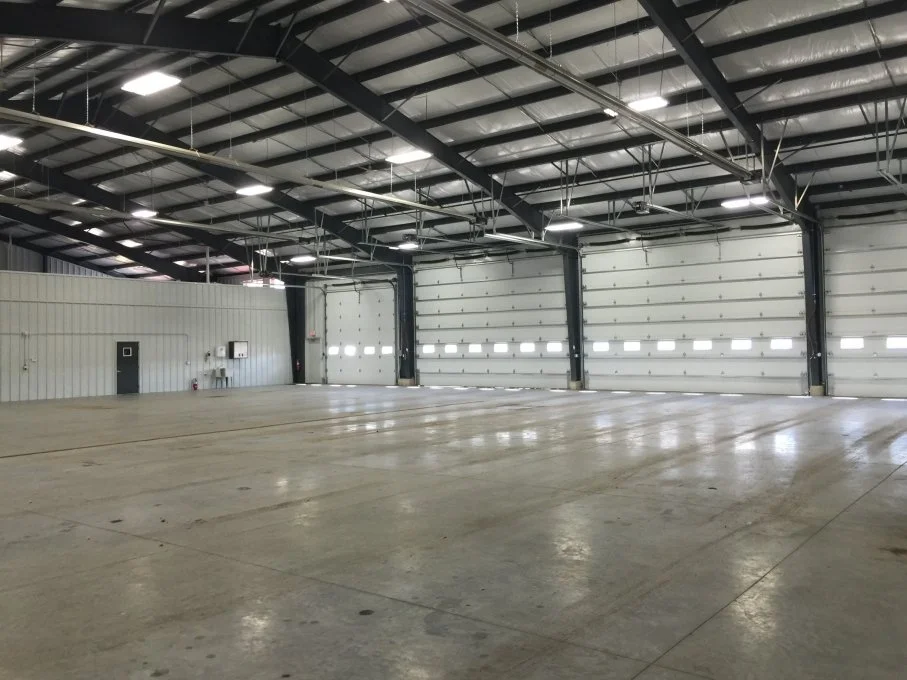 Industrial metal building with large overhead doors