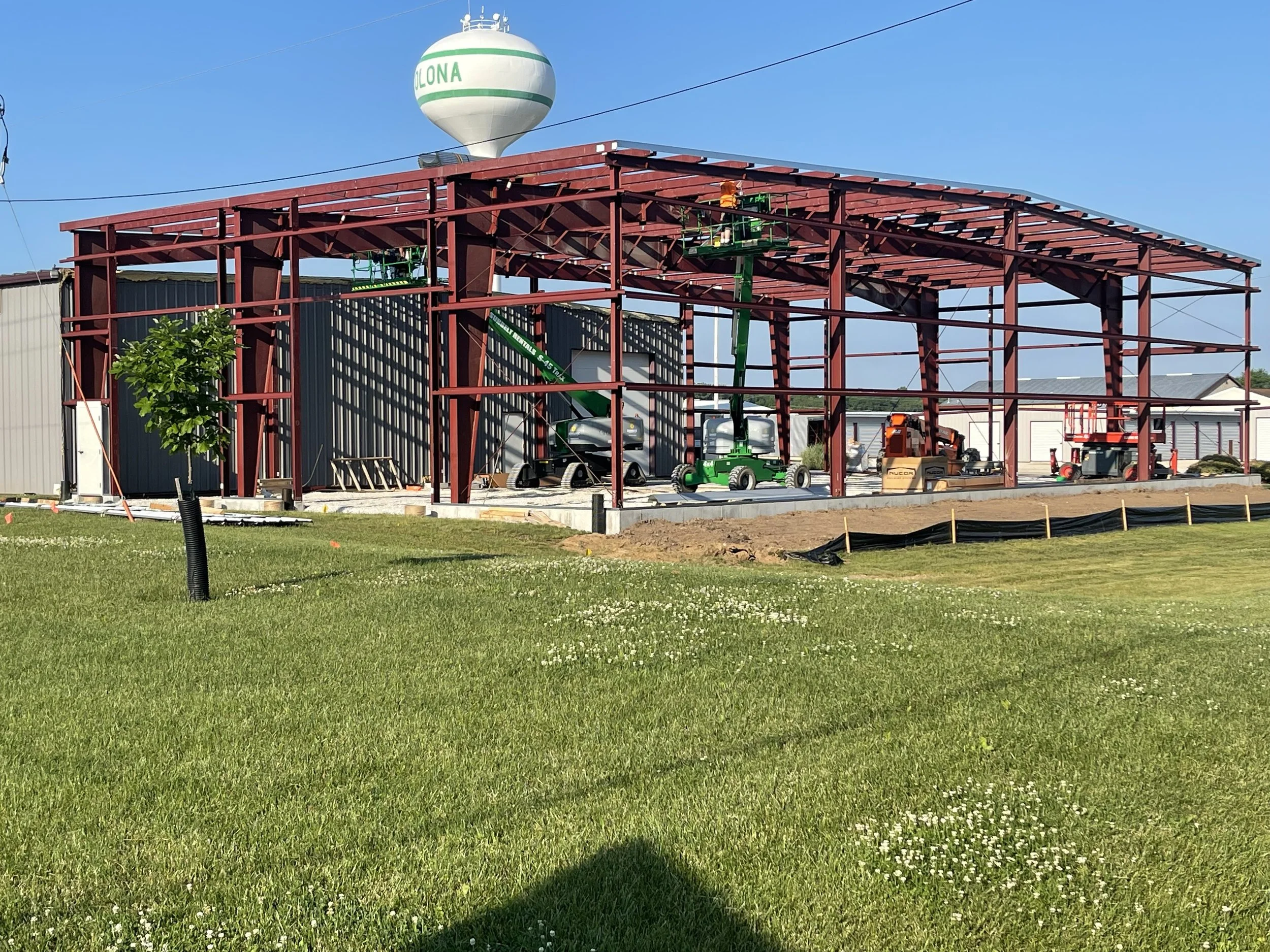 Metal building construction showing steel framework installation