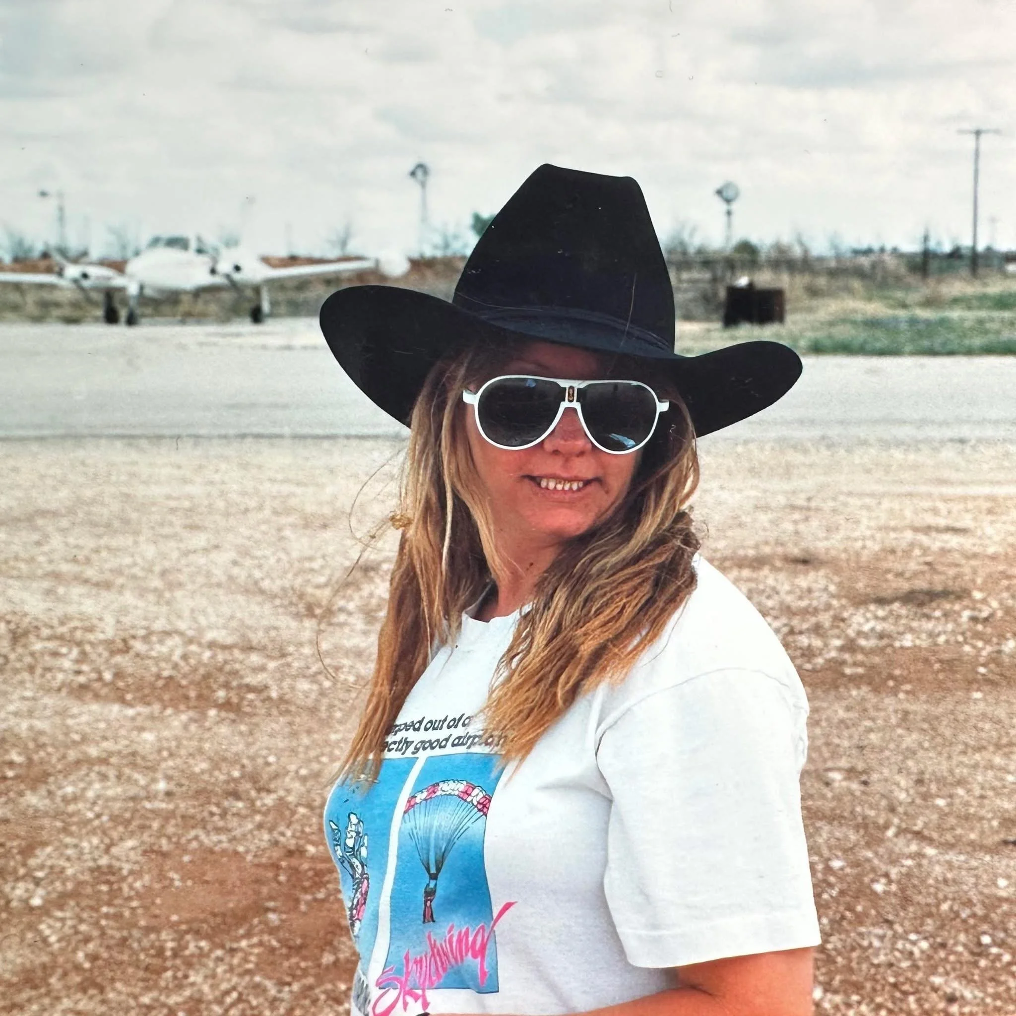 Woman in a cowboy hat and sunglasses
