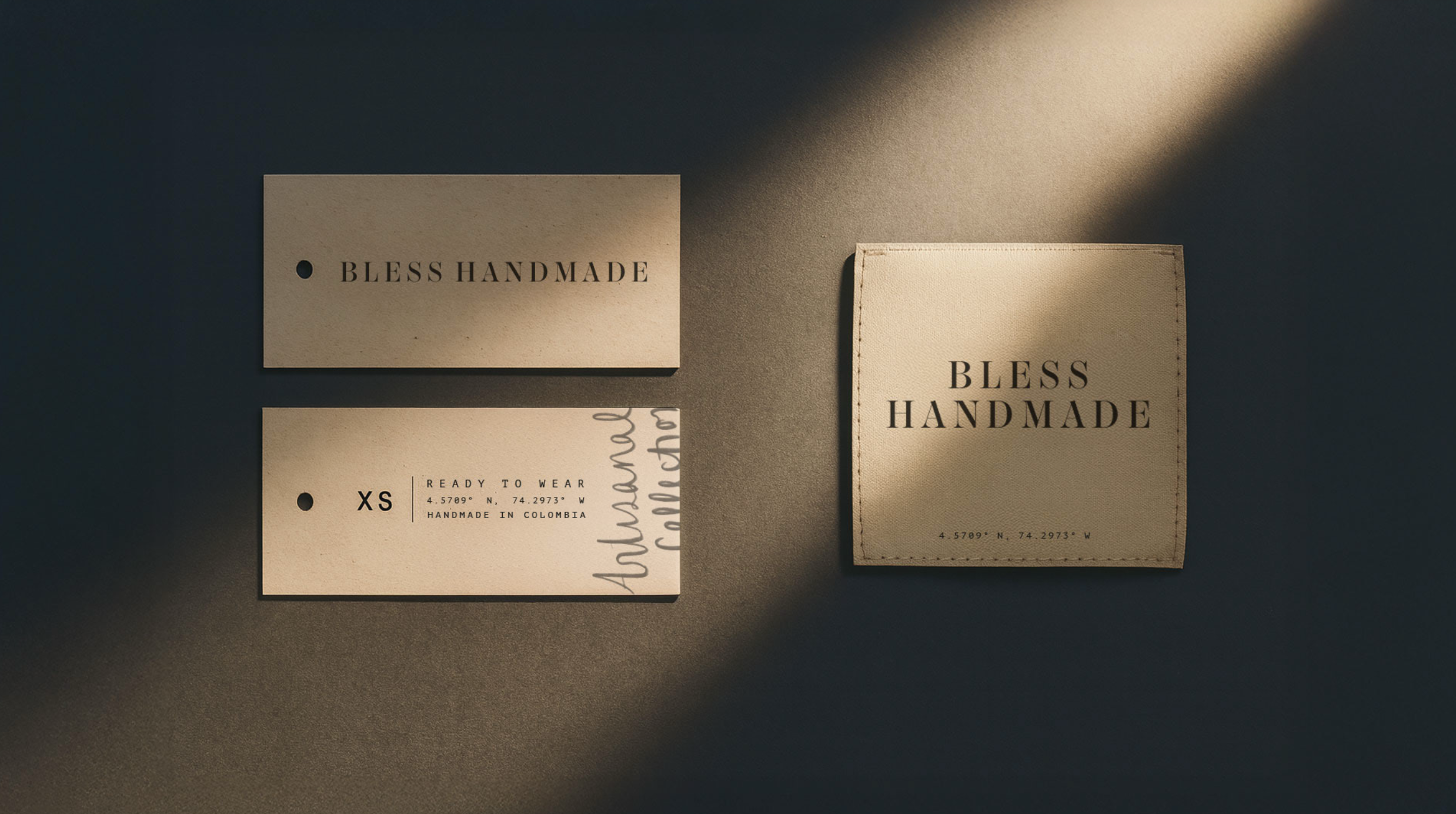 Etiquetas y bolso de tela con marca 'Bless Handmade' en luz suave y sombra.