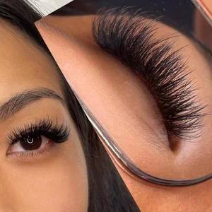 Close-up of a woman with long, thick eyelash extensions and well-groomed eyebrows.