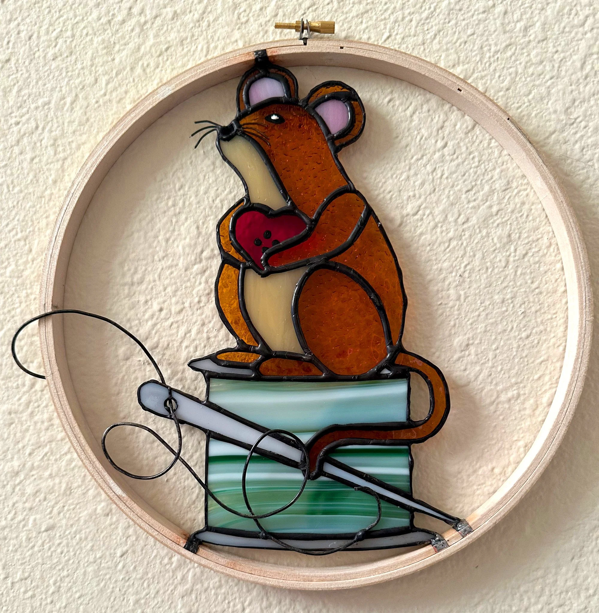 Gift commission to owner of needlepoint store.