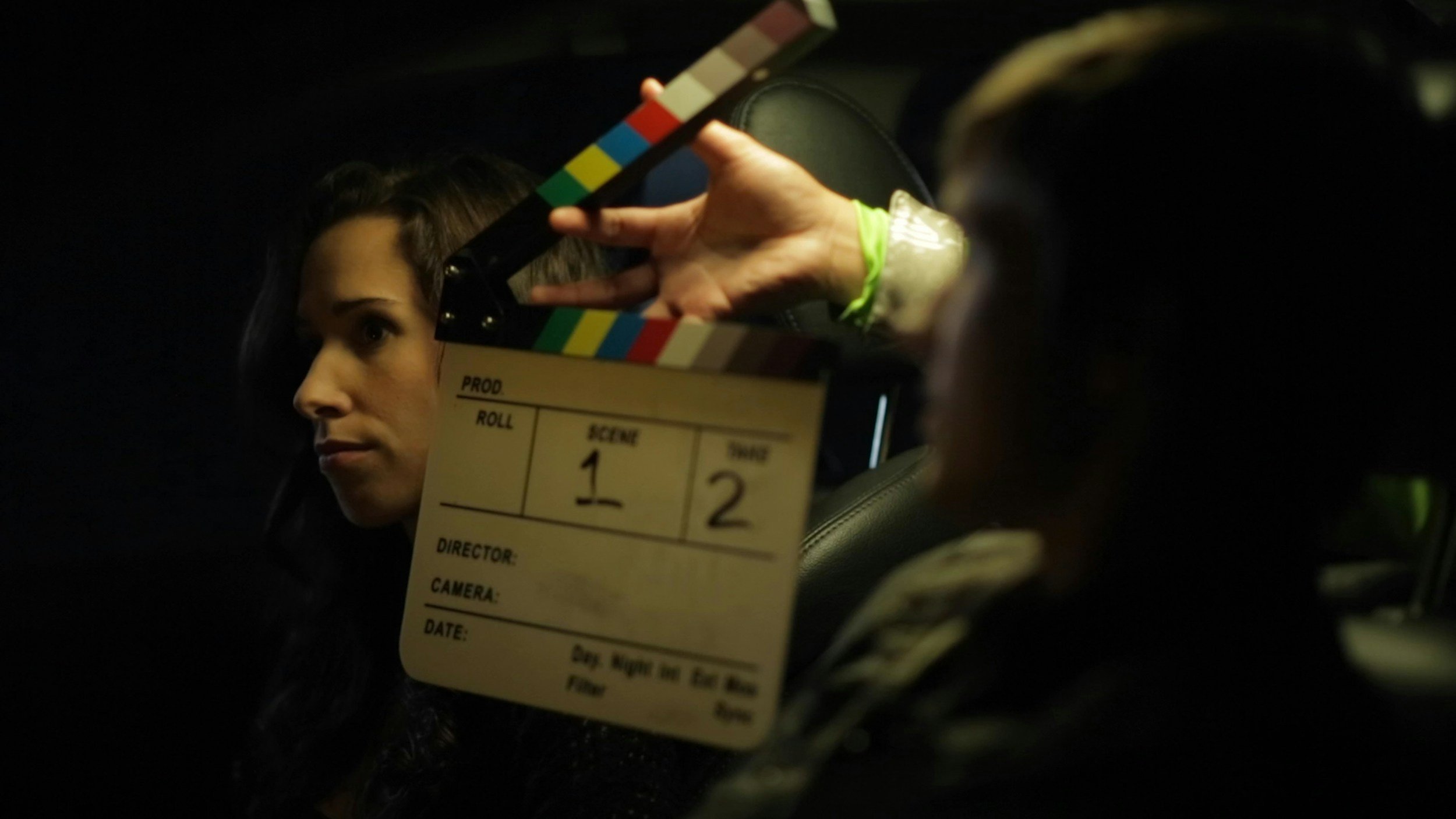 Our Time film still: Hands holding slate to film