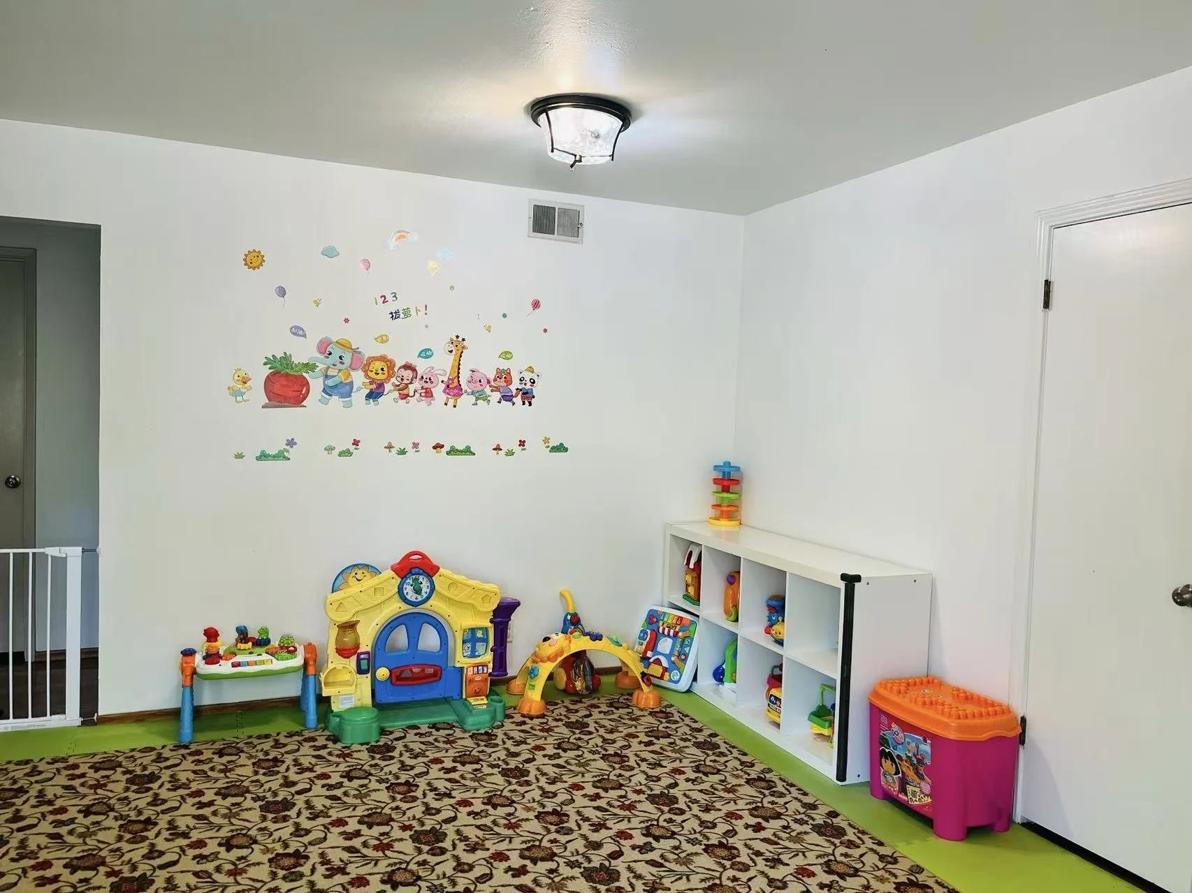 Indoor playroom at Red Apple Daycare in Santa Clara, offering a safe and organized space for play-based learning.