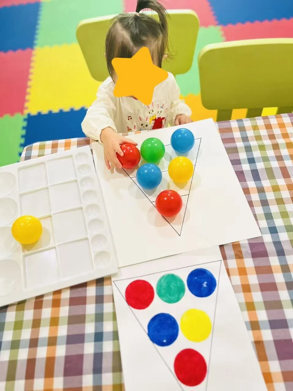Child participating in an art activity at Red Apple Daycare, developing creativity and fine motor skills through hands-on exploration.
