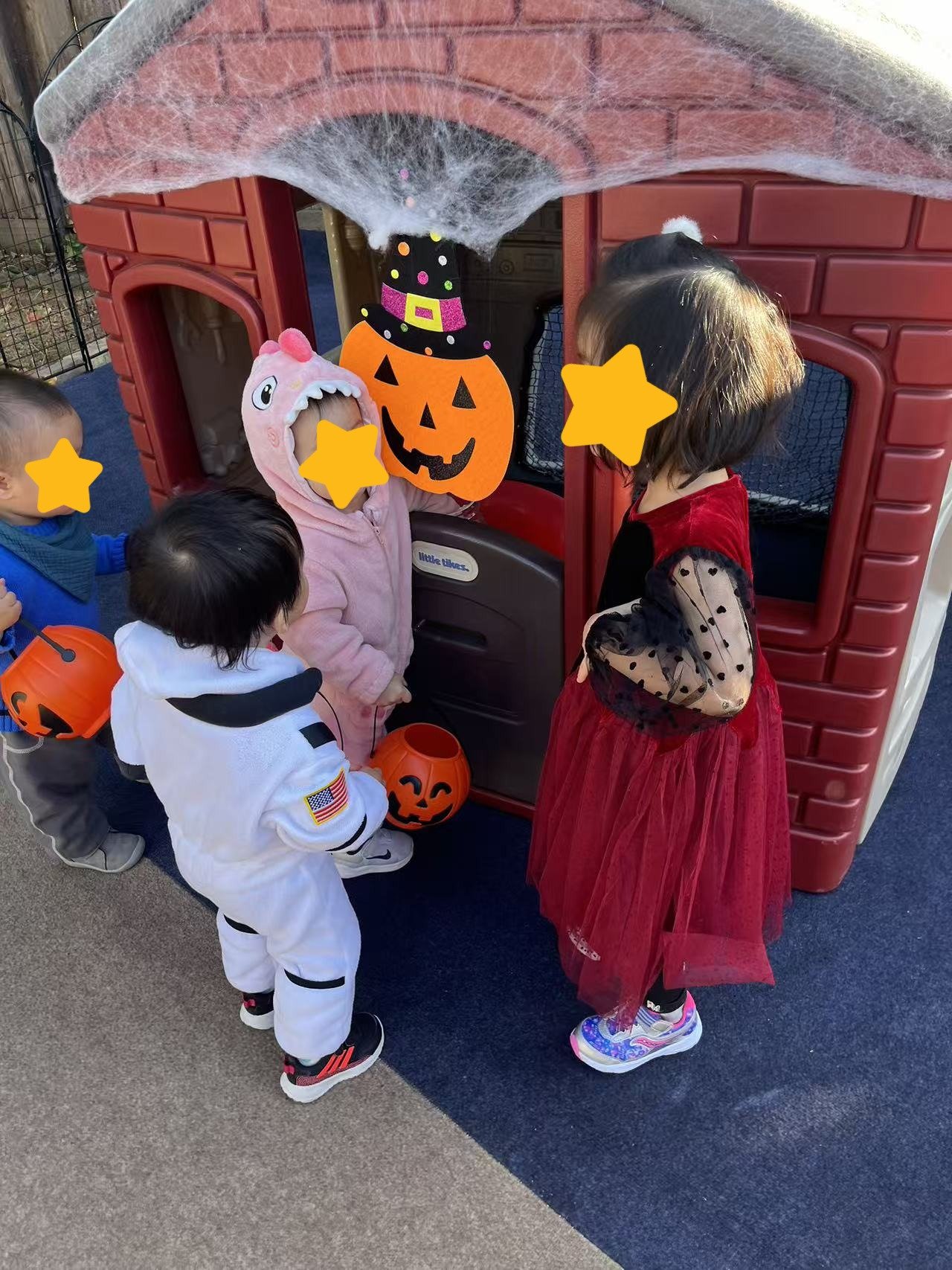 Children taking part in a Halloween celebration at Red Apple Daycare, building social skills through group activities.

