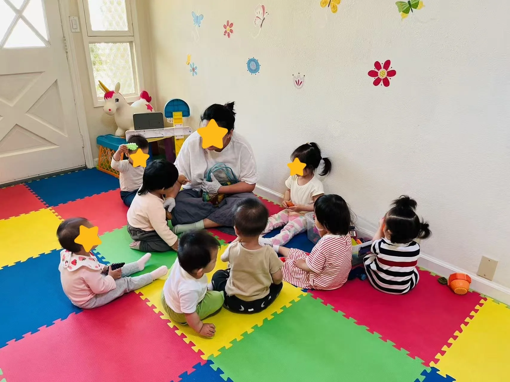 Children participating in group activities at Red Apple Daycare, learning together in a calm and supportive environment.
