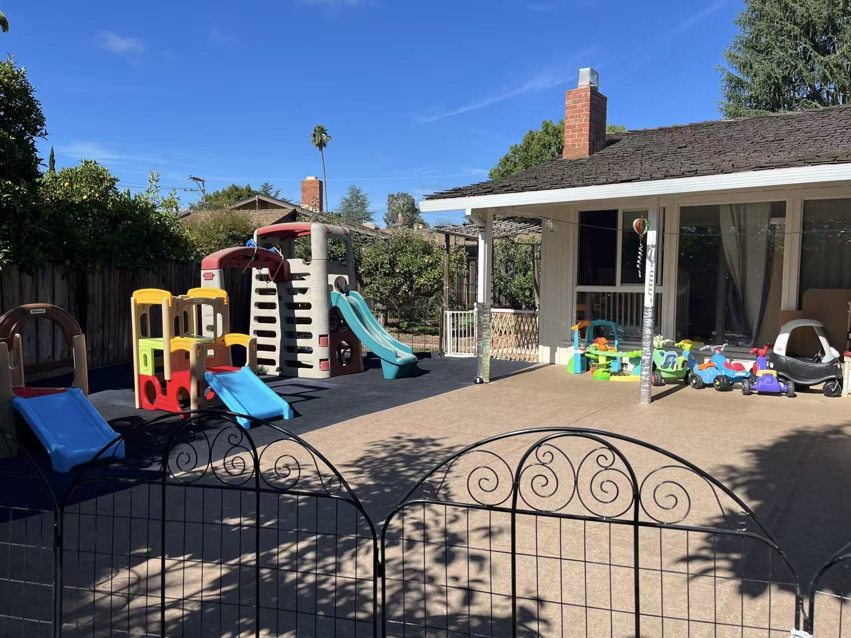 Outdoor playground at Red Apple Daycare in Santa Clara, providing a safe space for physical play and gross motor development.